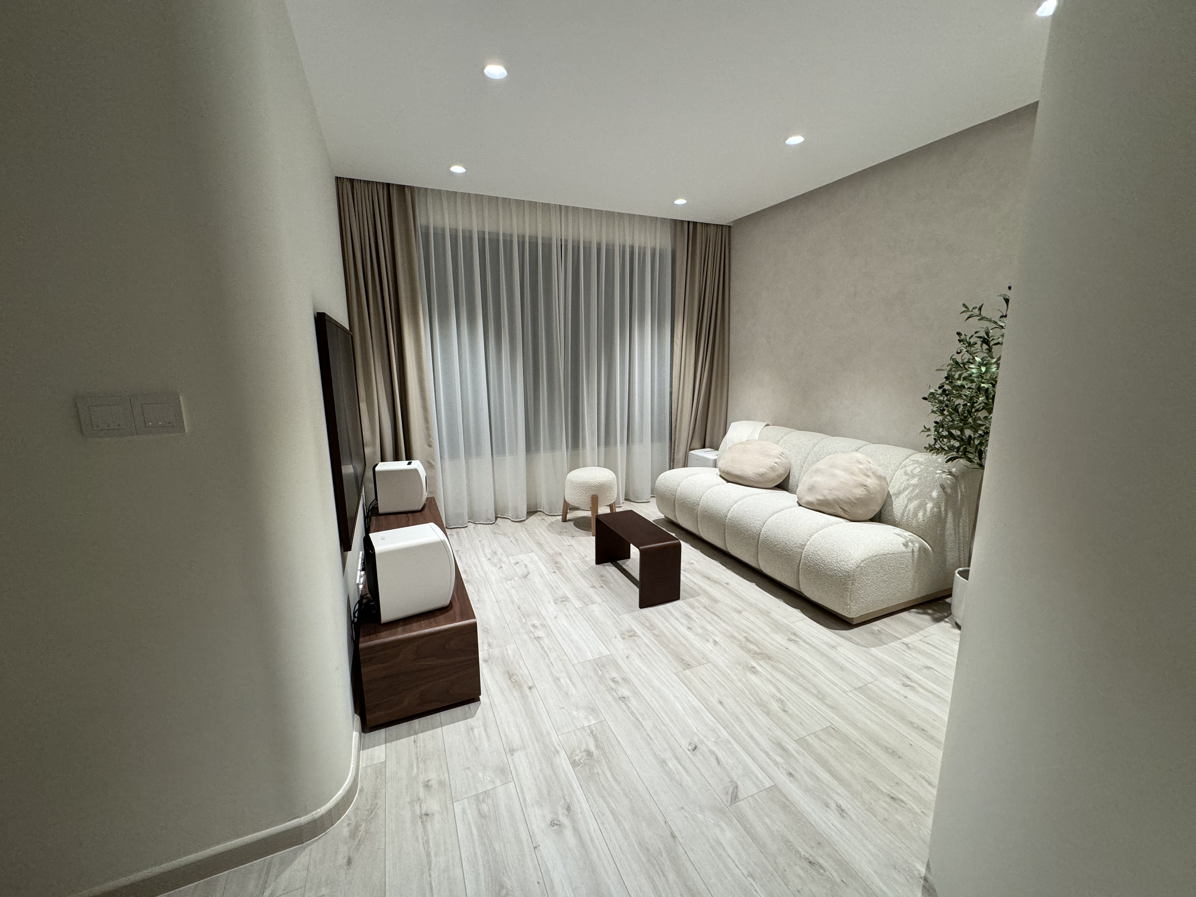 Love (our living room’s) curves & all (it’s) edges ❤️ - Modern living room with beige sofa, white cushions, wooden coffee