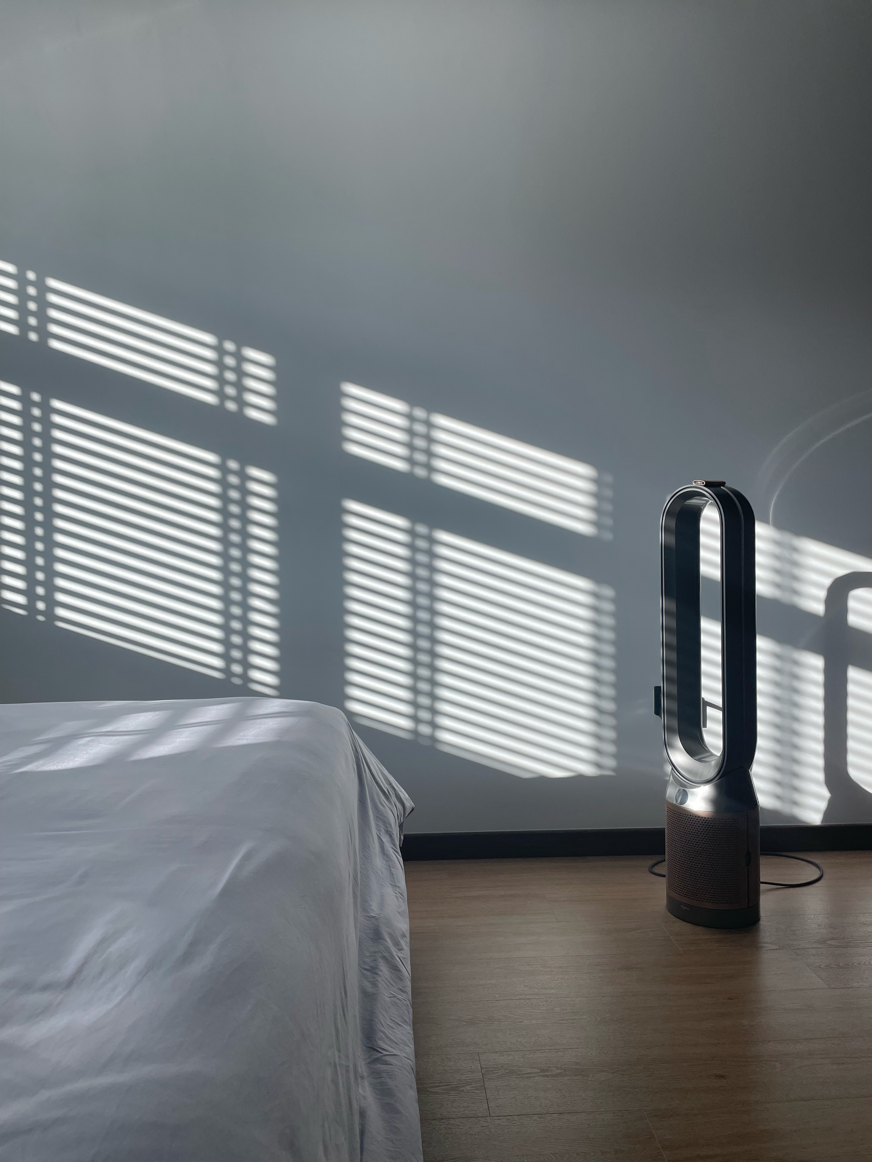 Recommended appliances, or rather a must have! - Sunlight streaming through blinds, casting shadows on the wall, modern air