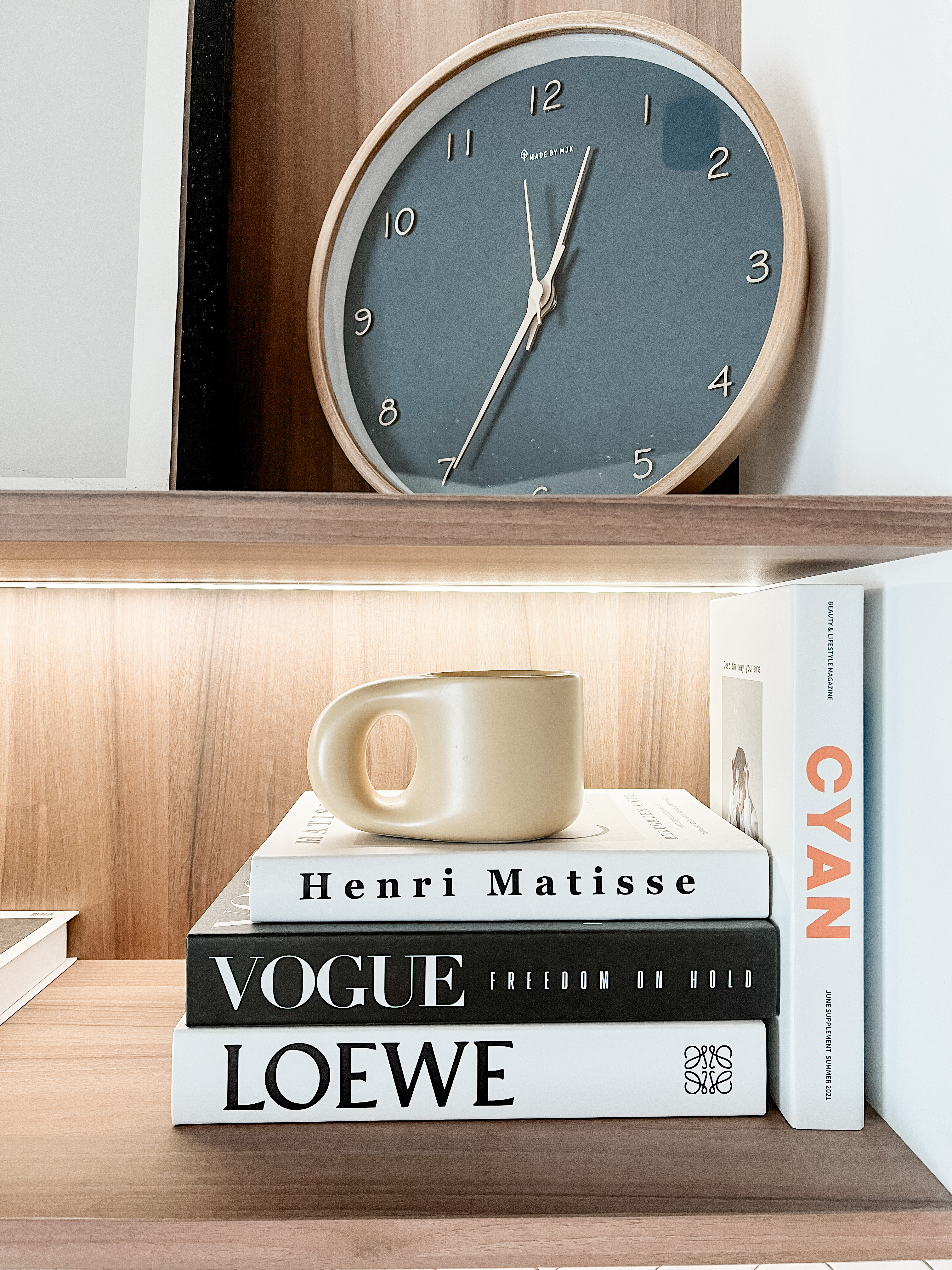 The heart of the home: Our Dining Room - Modern minimalist interior with a wooden shelf, Elegant wall clock with a round