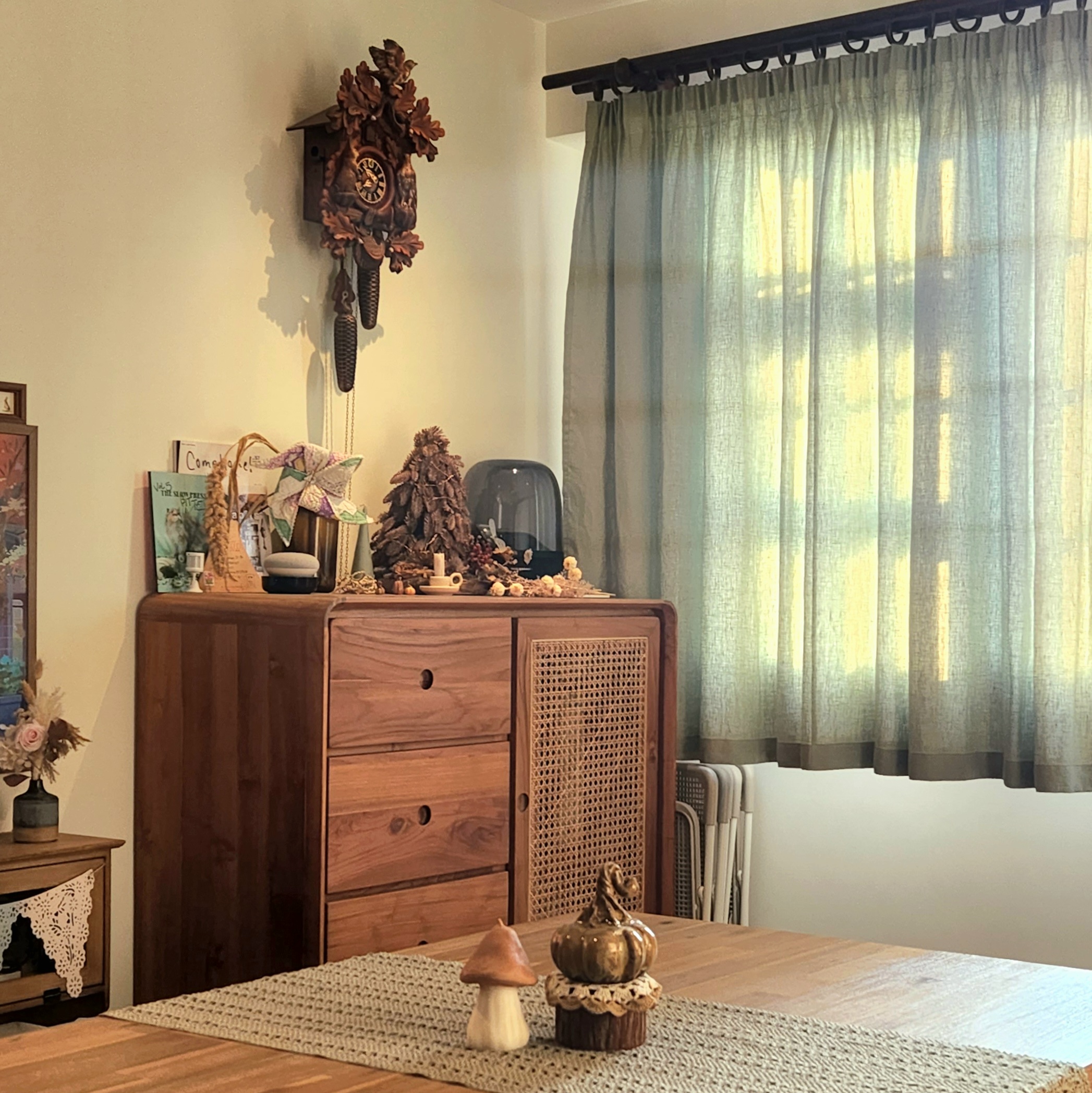 Gather here: Living and dining in the same space - Wooden dresser, decorative clock, rustic charm, autumn theme, natural