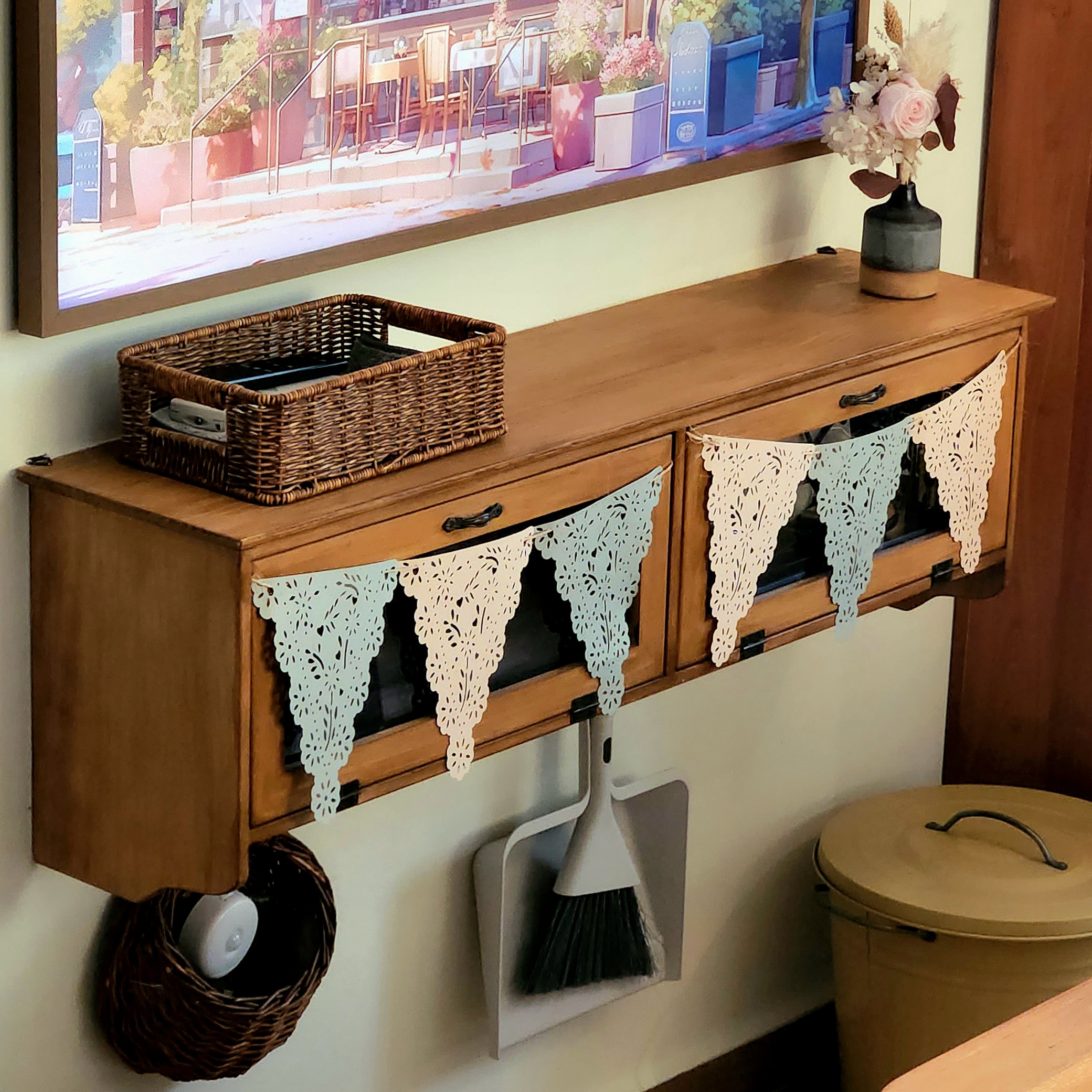 Gather here: Living and dining in the same space - Wooden cabinet with decorative items, wicker basket on top, light blue