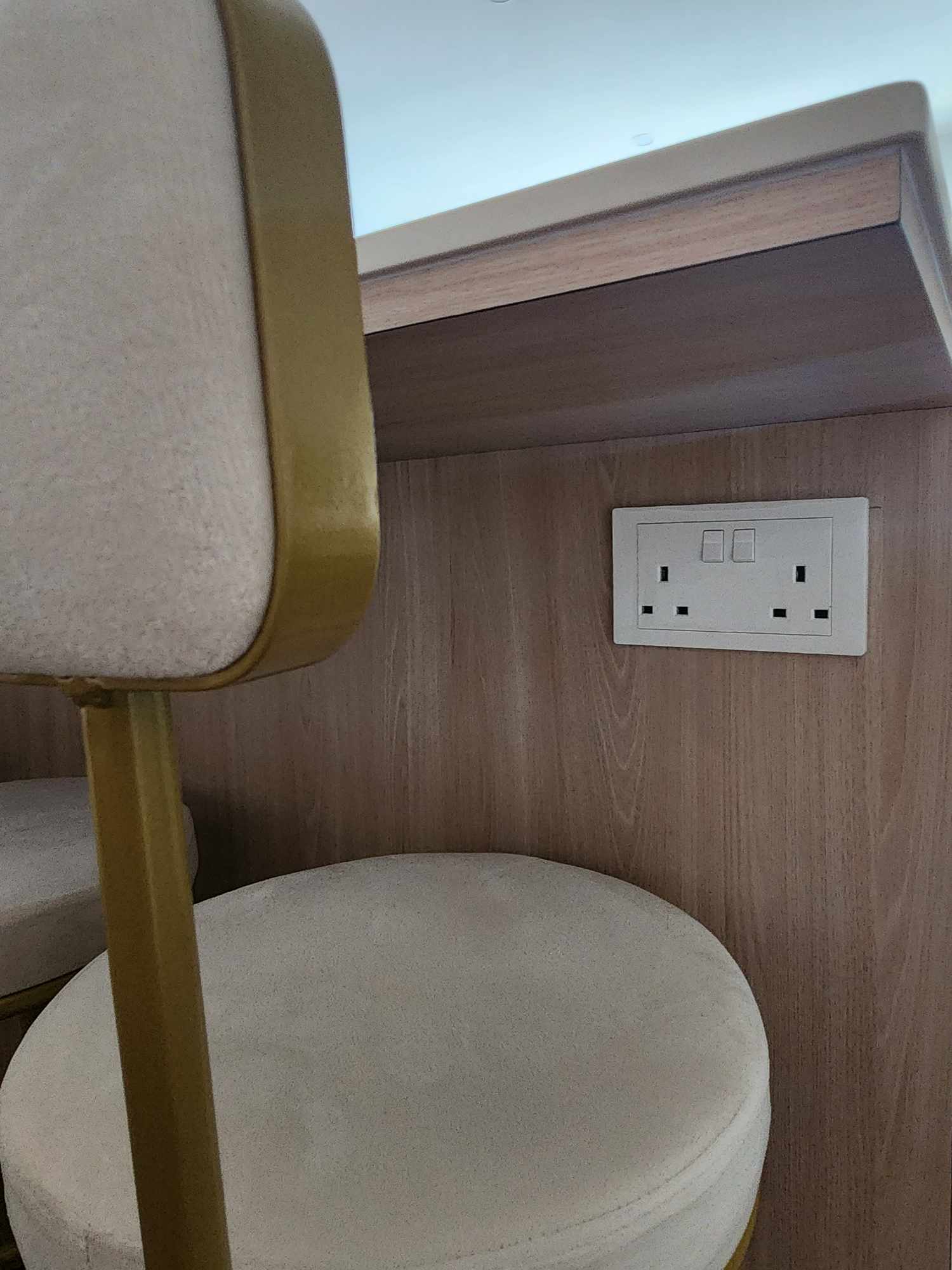 Our cozy dining space with a dry kitchen  - Wooden wall, beige chair, gold frame, round cushion, wooden panel, electrical