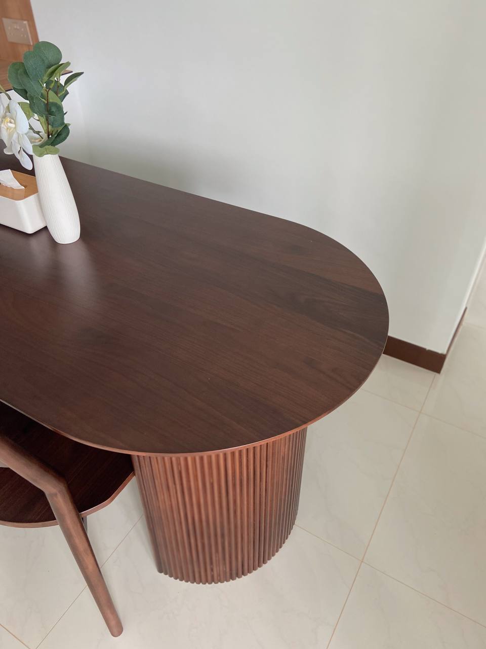 The Heart of the Home: Our Dining Space - Wooden round table, minimalist design, dark wood finish, cylindrical base, white