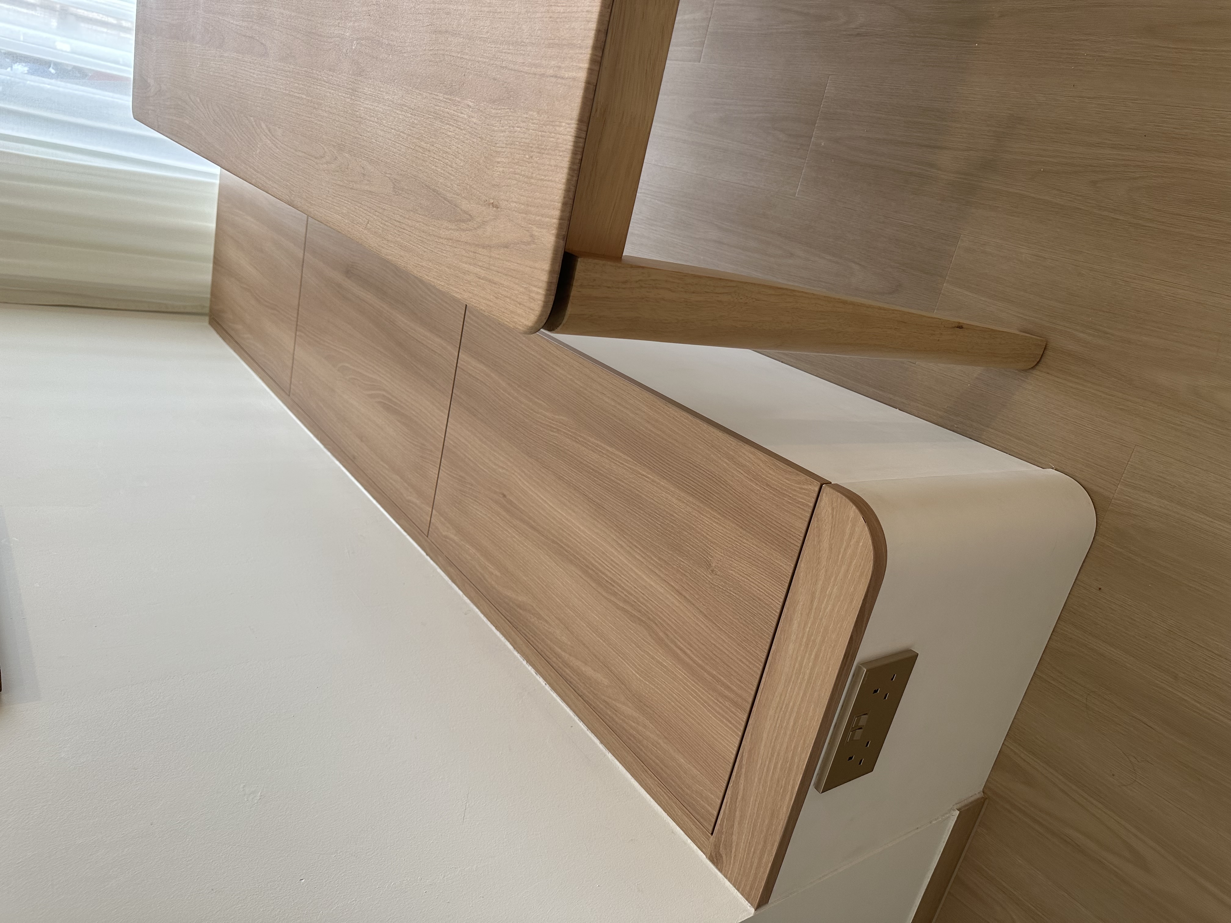 Our multi purpose dining room - Wooden bed frame, light brown wood, sleek design, modern furniture, minimalist decor, wooden