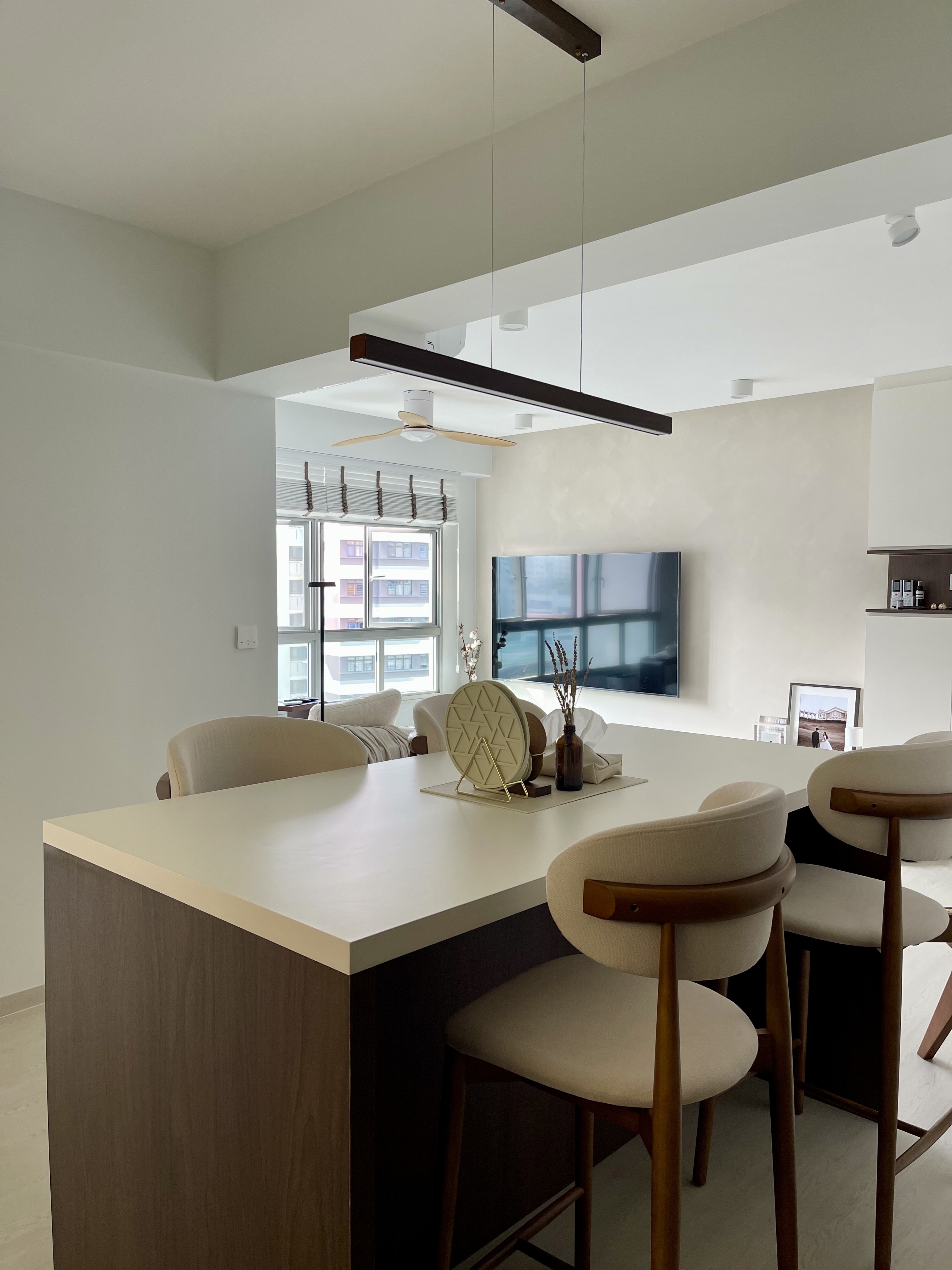 Gather around our island, the main activity zone in our house - Modern minimalist dining room, sleek ceiling fan, large