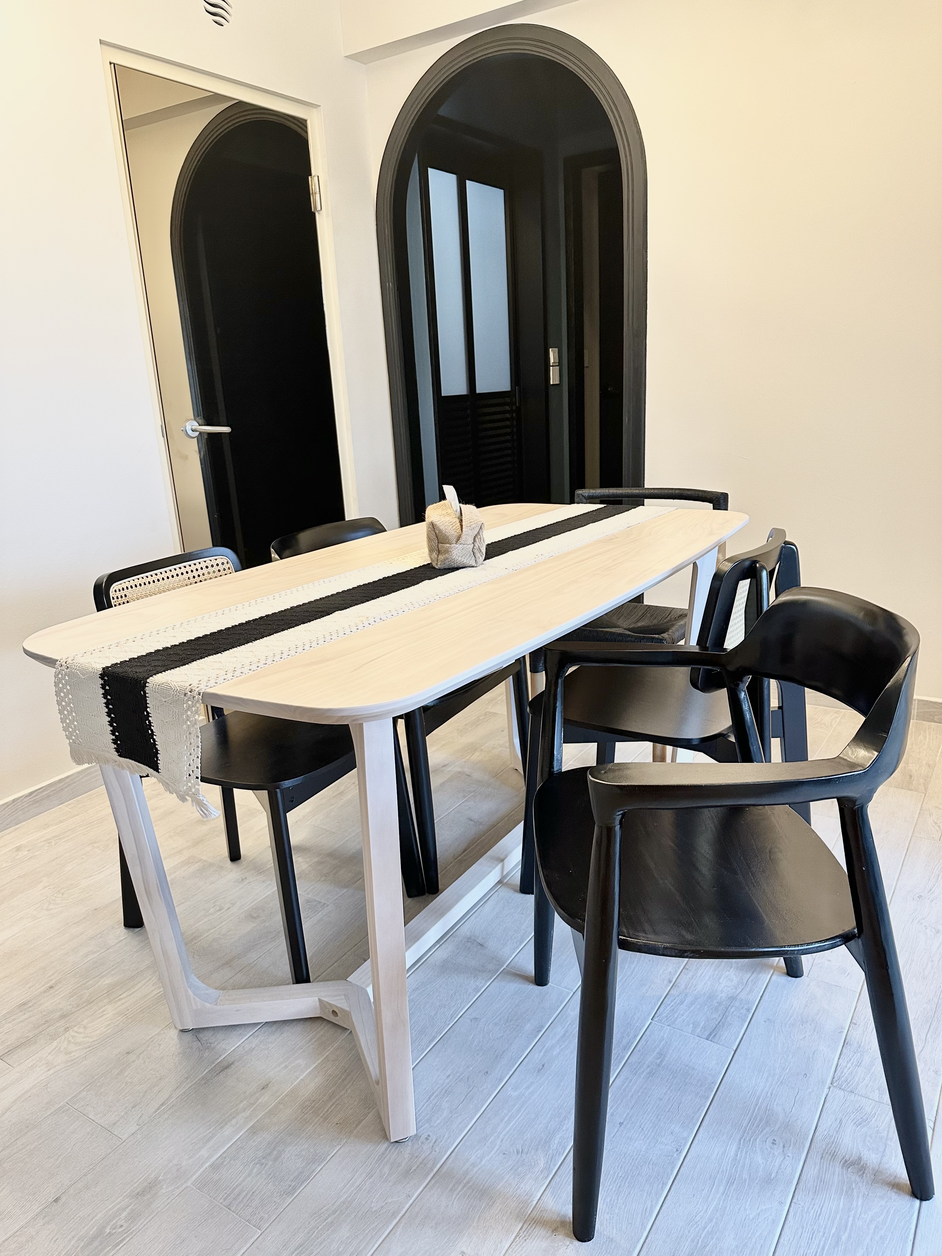 Making space for our dining area!  - modern dining room, minimalist design, sleek table, black chairs, contemporary