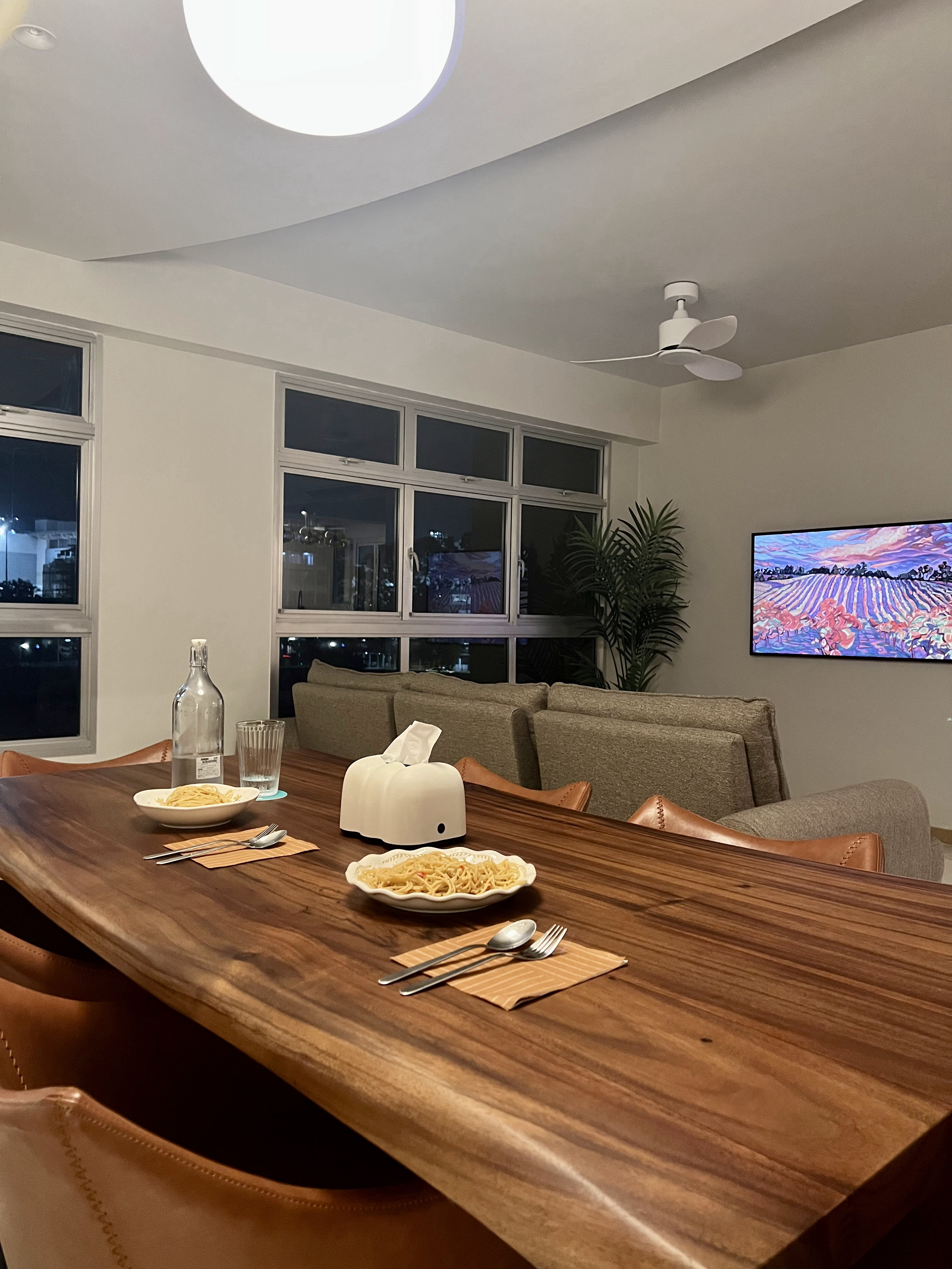 A Seat at Our Table: Discovering Our Dining Space - Wooden dining table, modern living room, cozy ambiance, large windows