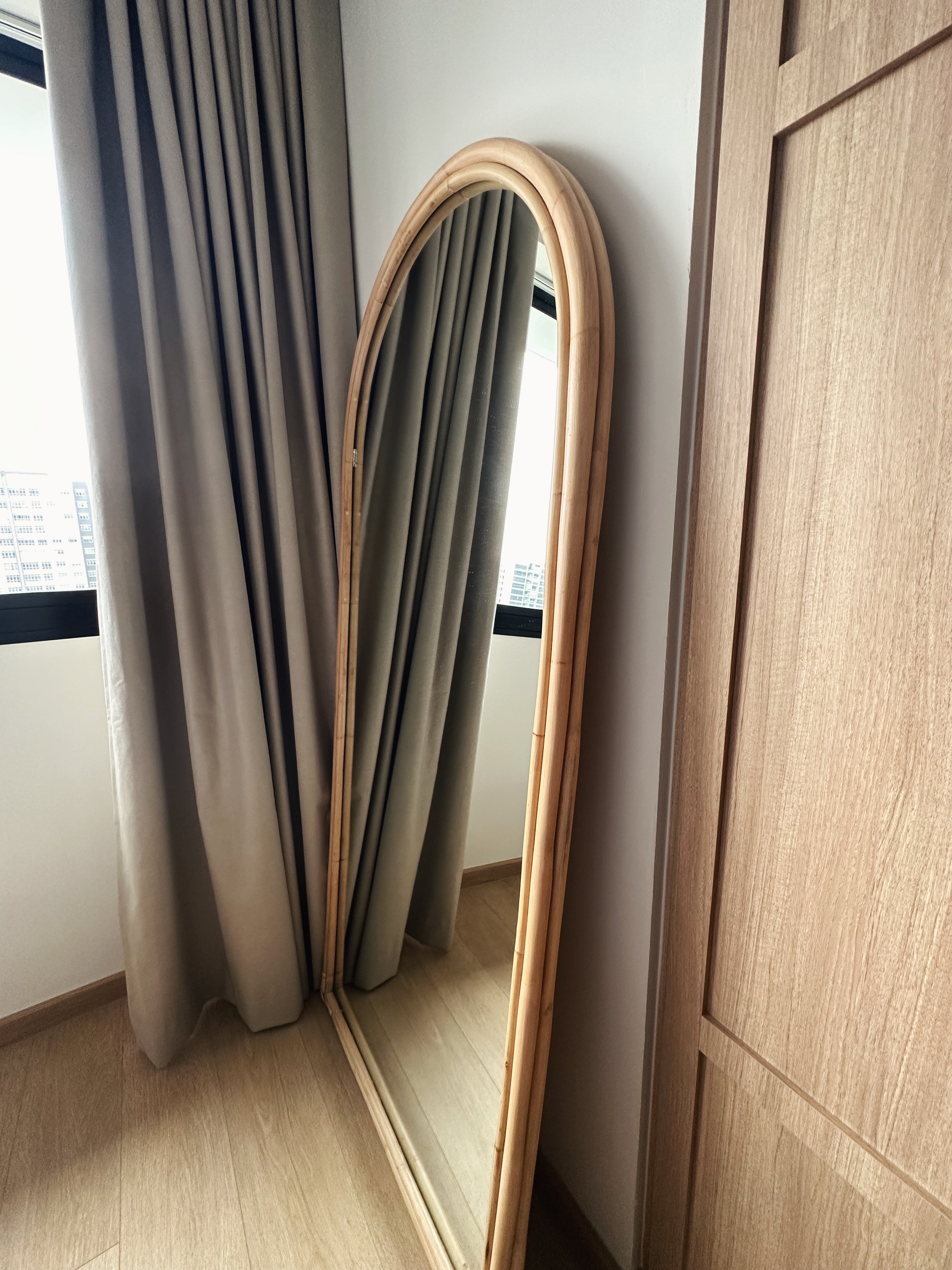 Really just warming up  - Wooden mirror, light-colored walls, sheer curtains, modern interior, minimalist decor, natural wood