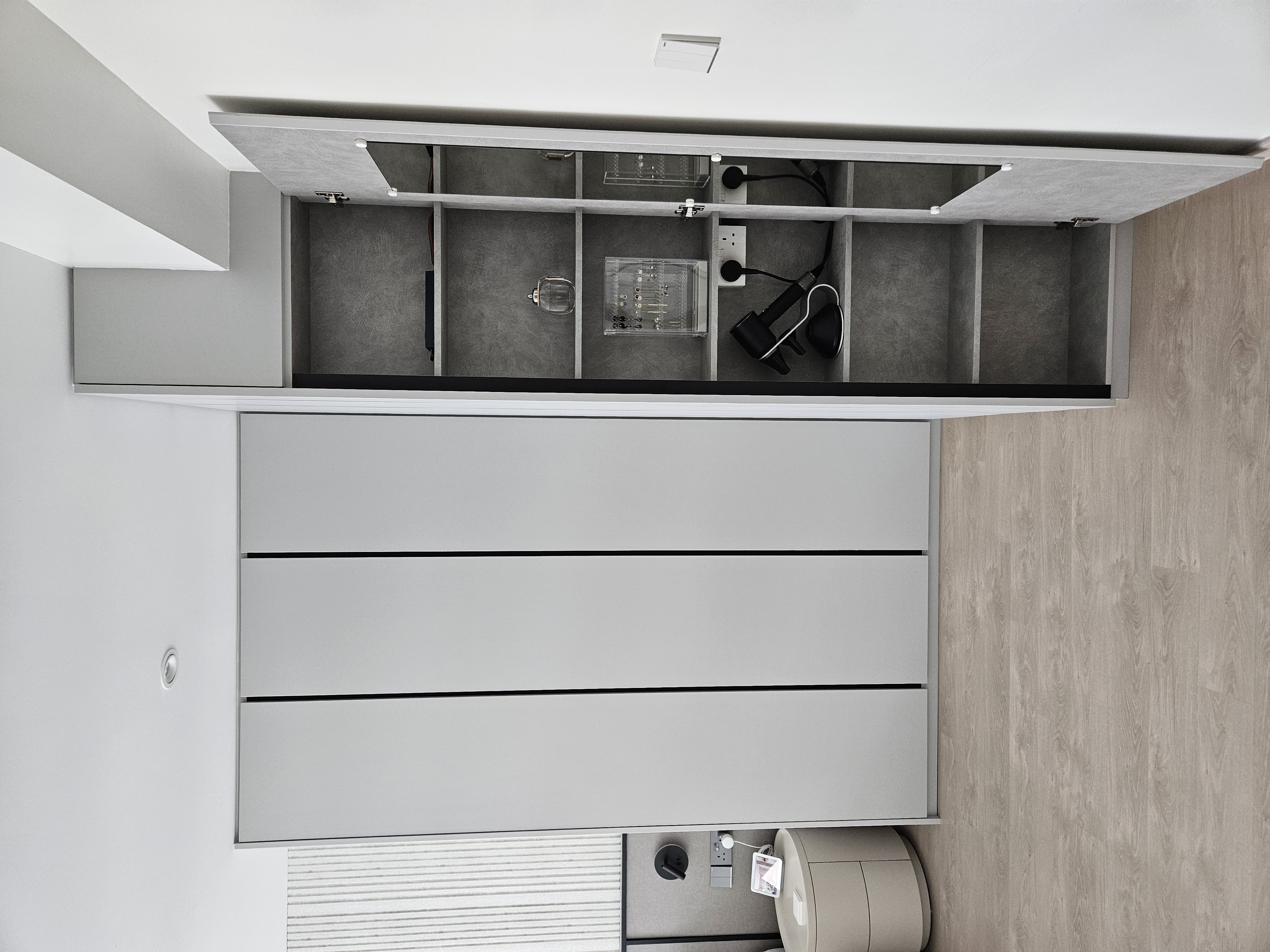 Explore Our Muted and Calming Bedroom - Gray kitchen cabinets, minimalist design, open shelves, modern storage, sleek