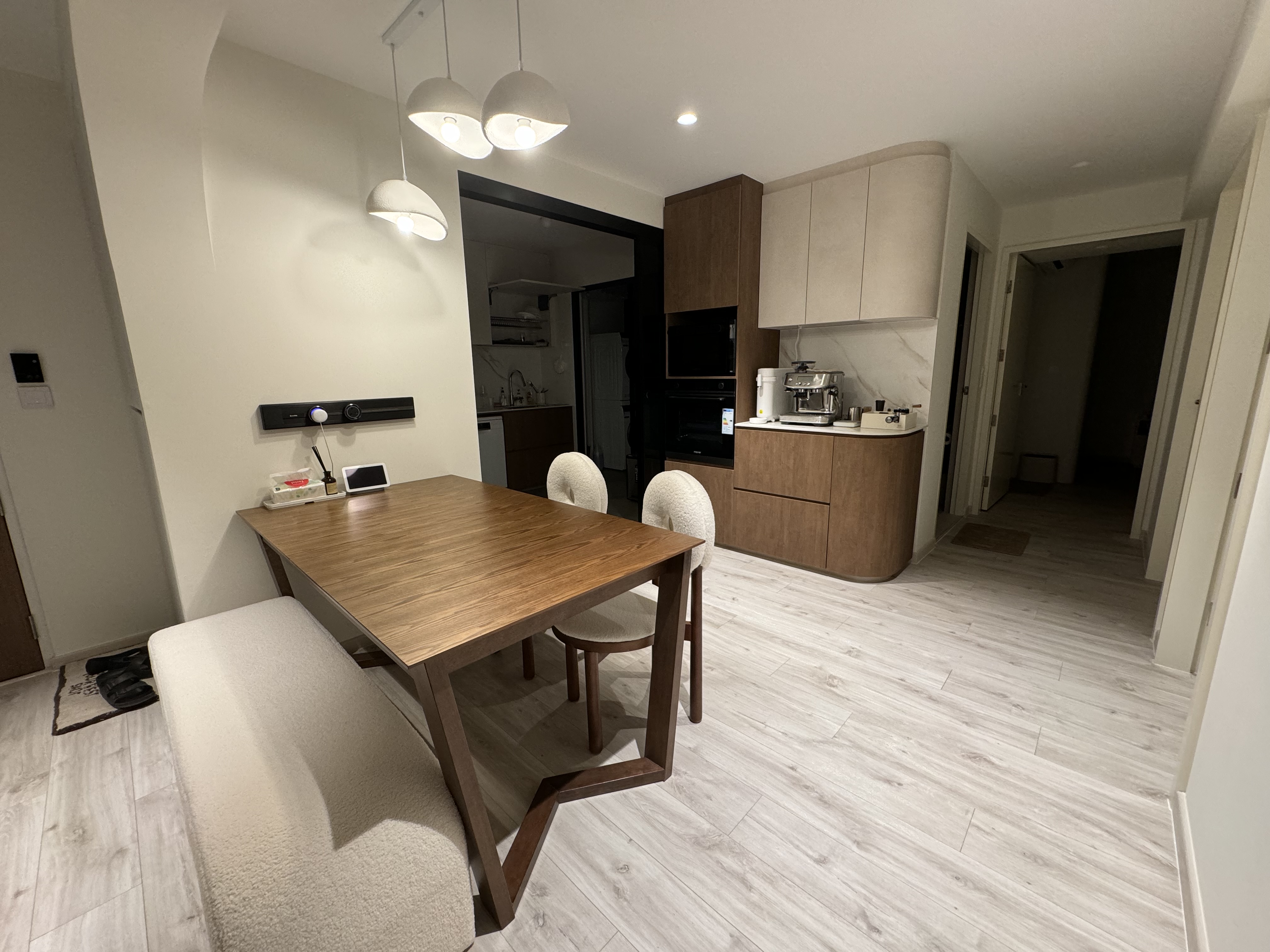 Our versatile dining area - perfect for meals, work, beer pong & more! - Wooden dining table, modern kitchen, beige chairs