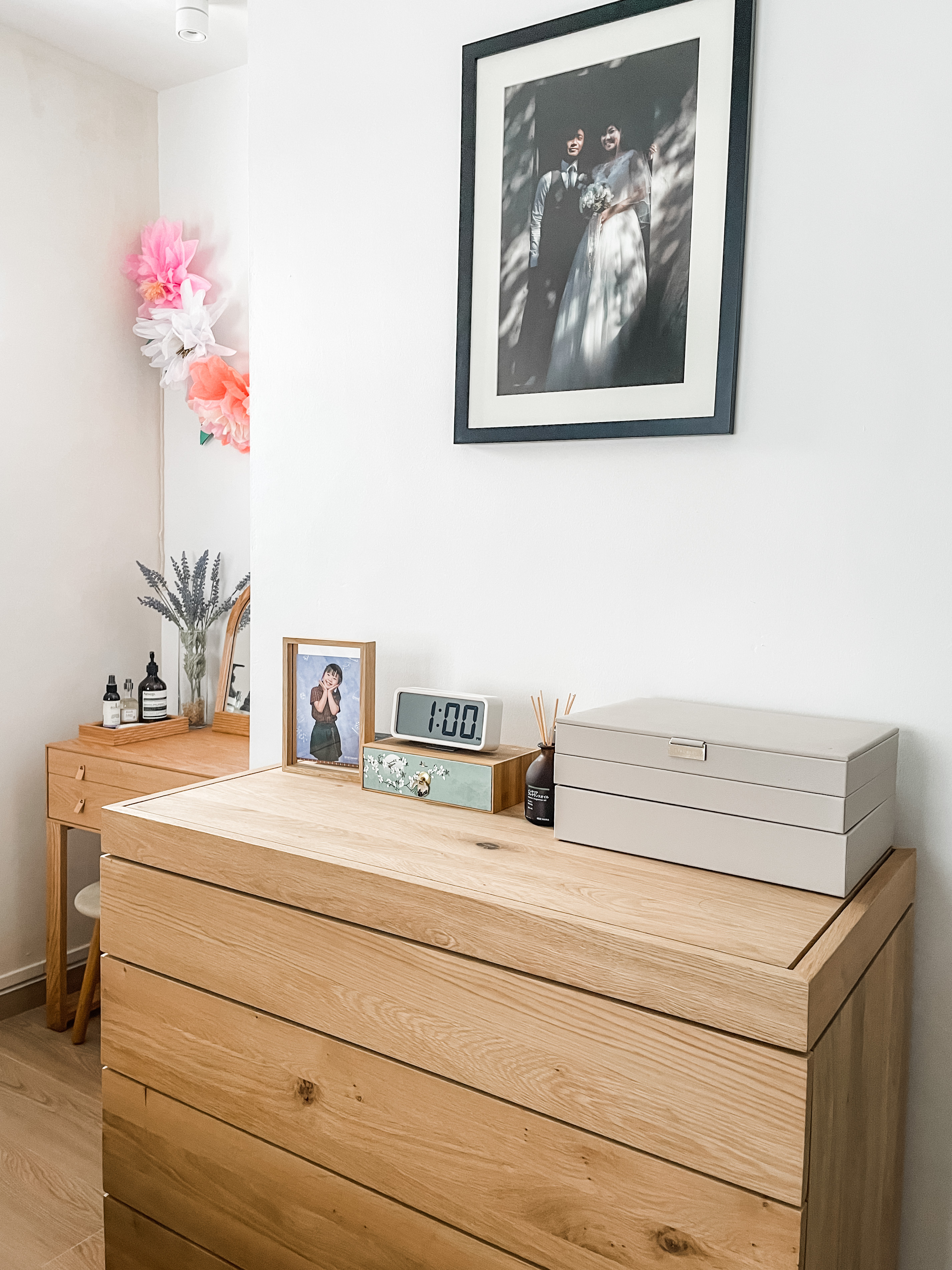 Our Master Bedroom: A Restful Retreat  - Wooden dresser, minimalist design, light wood finish, natural texture, layered