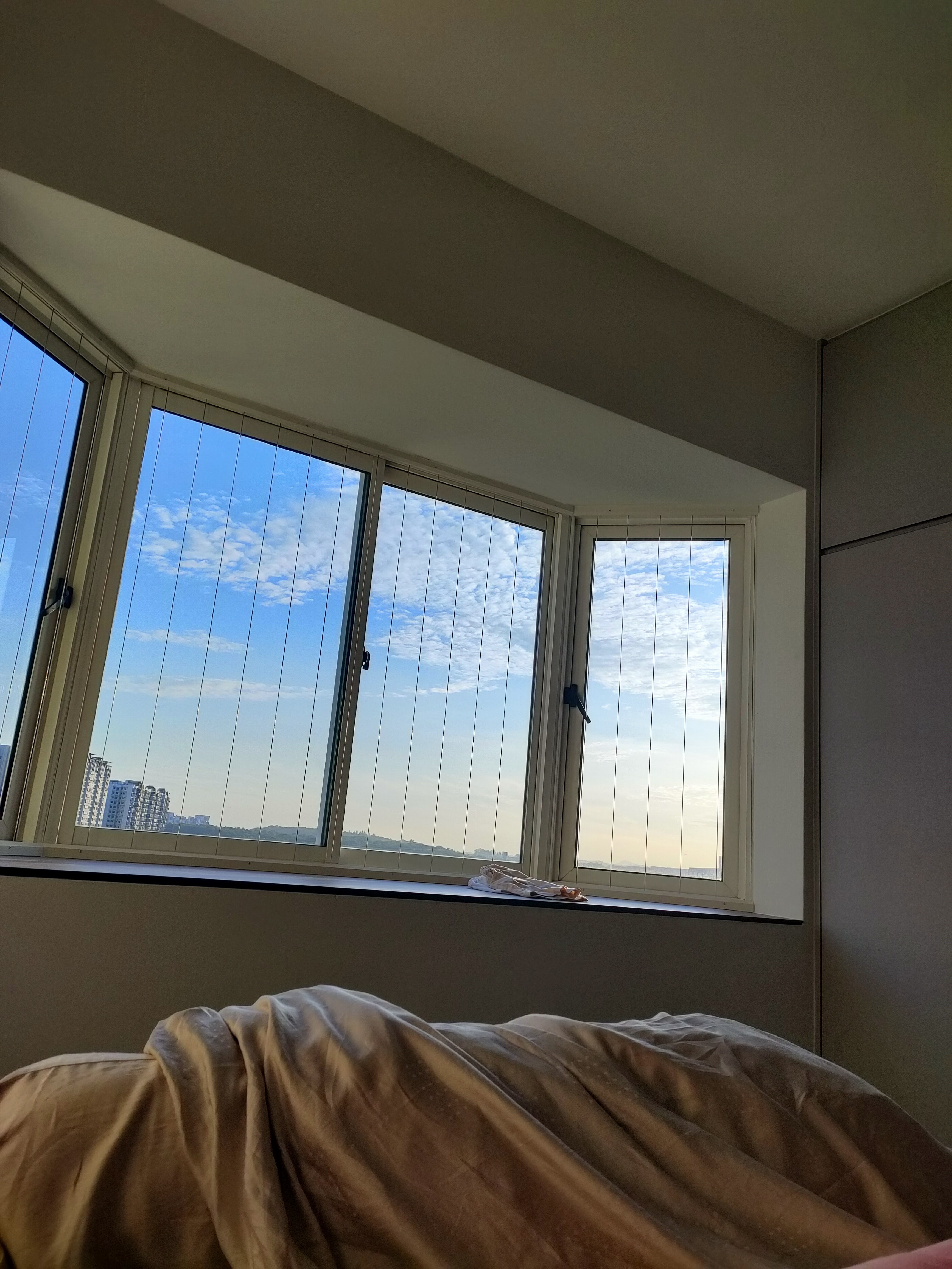 Masterbedroom.. Our sanctuary after a hard's day of work - Large windows, blue sky, clouds, cityscape, daytime, natural