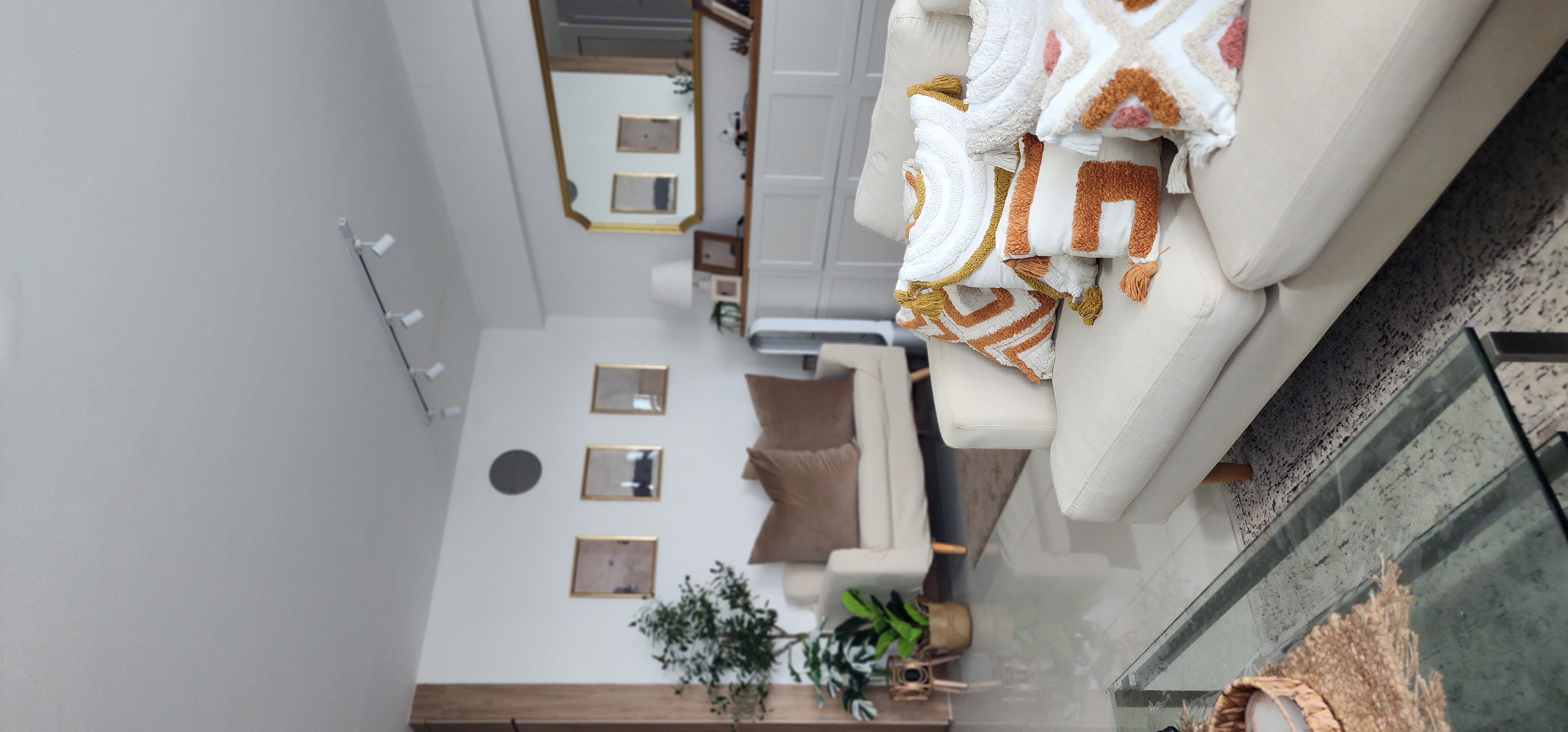 Home Decor is your answer to happiness!  - Modern living room, cozy seating area, minimalist decor, white walls, beige sofa