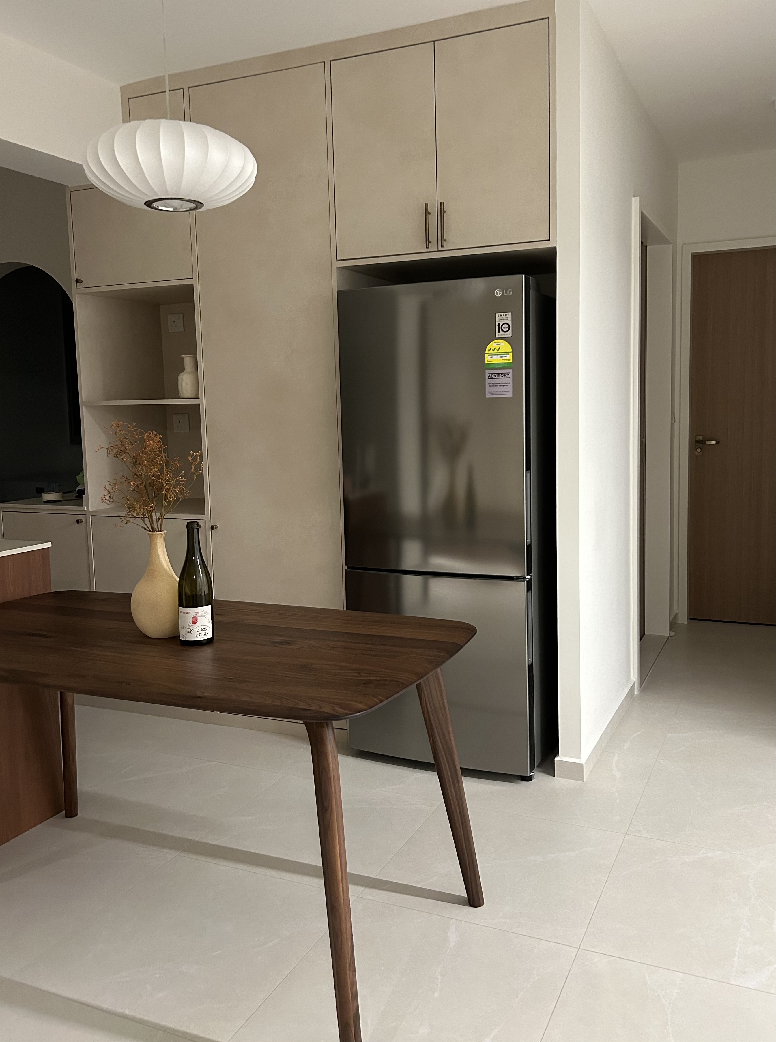 The Dining Space: The Heart of Our Home! - Modern kitchen with sleek design, minimalist furniture, large refrigerator, wooden