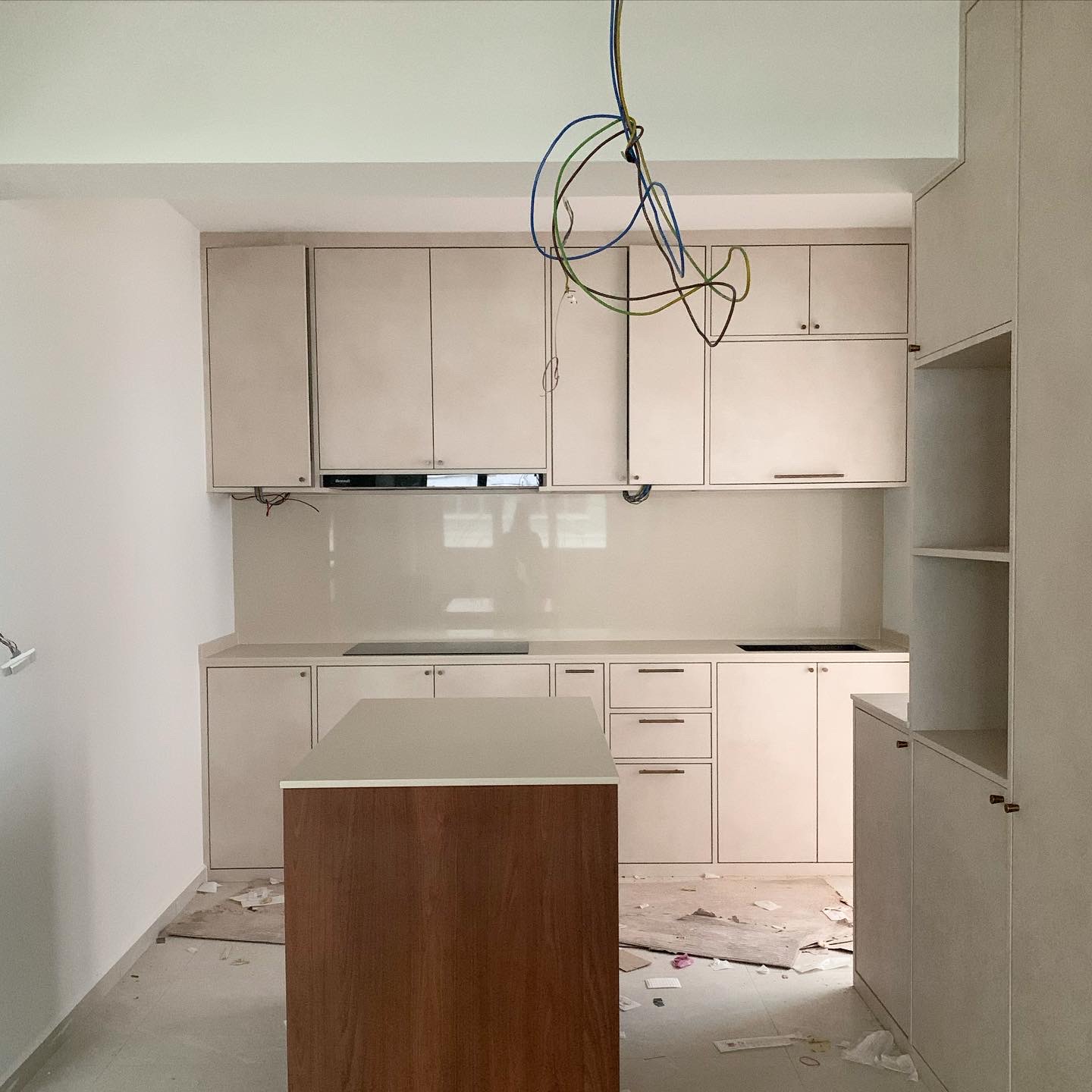 The Dining Space: The Heart of Our Home! - Modern kitchen with white cabinetry, unfinished countertops, exposed wiring