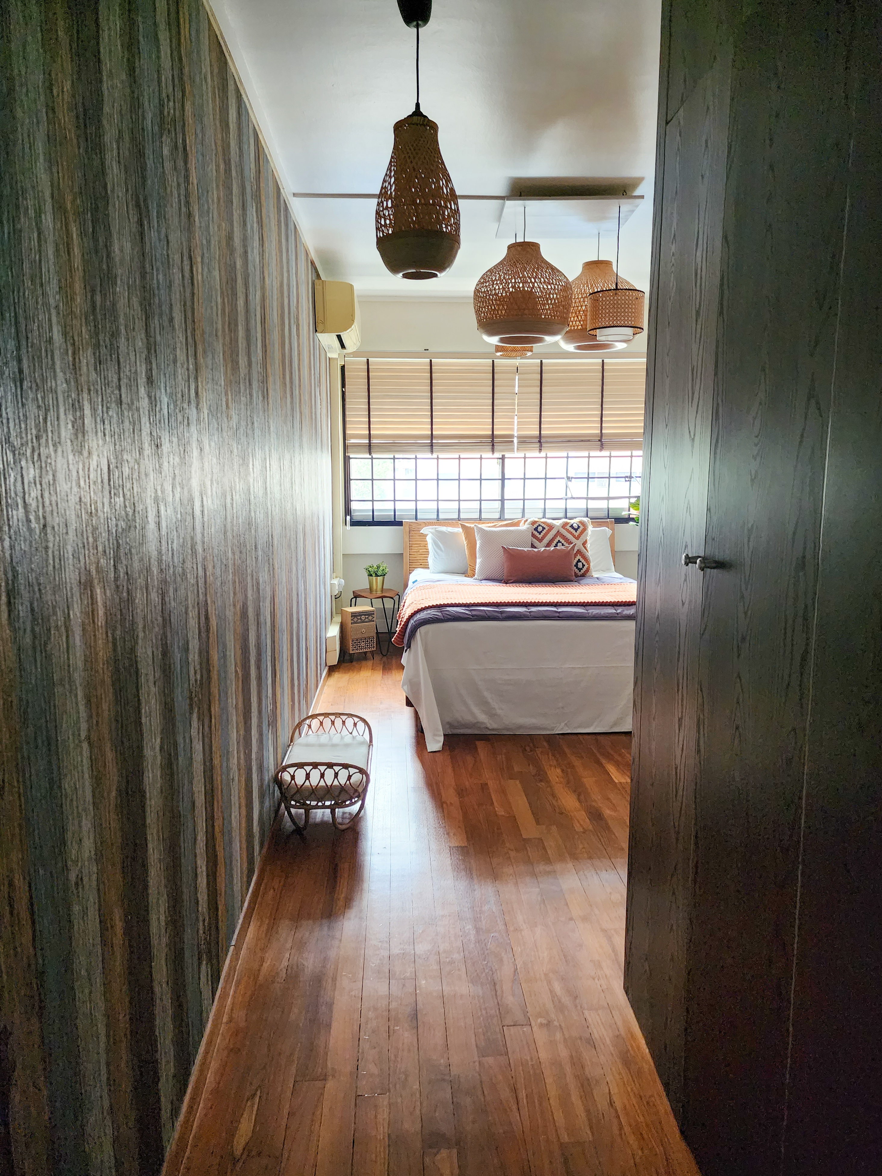 Cosy Escapade - Wooden floor, modern bedroom, wooden walls, wicker furniture, large window, striped wallpaper, wooden blinds