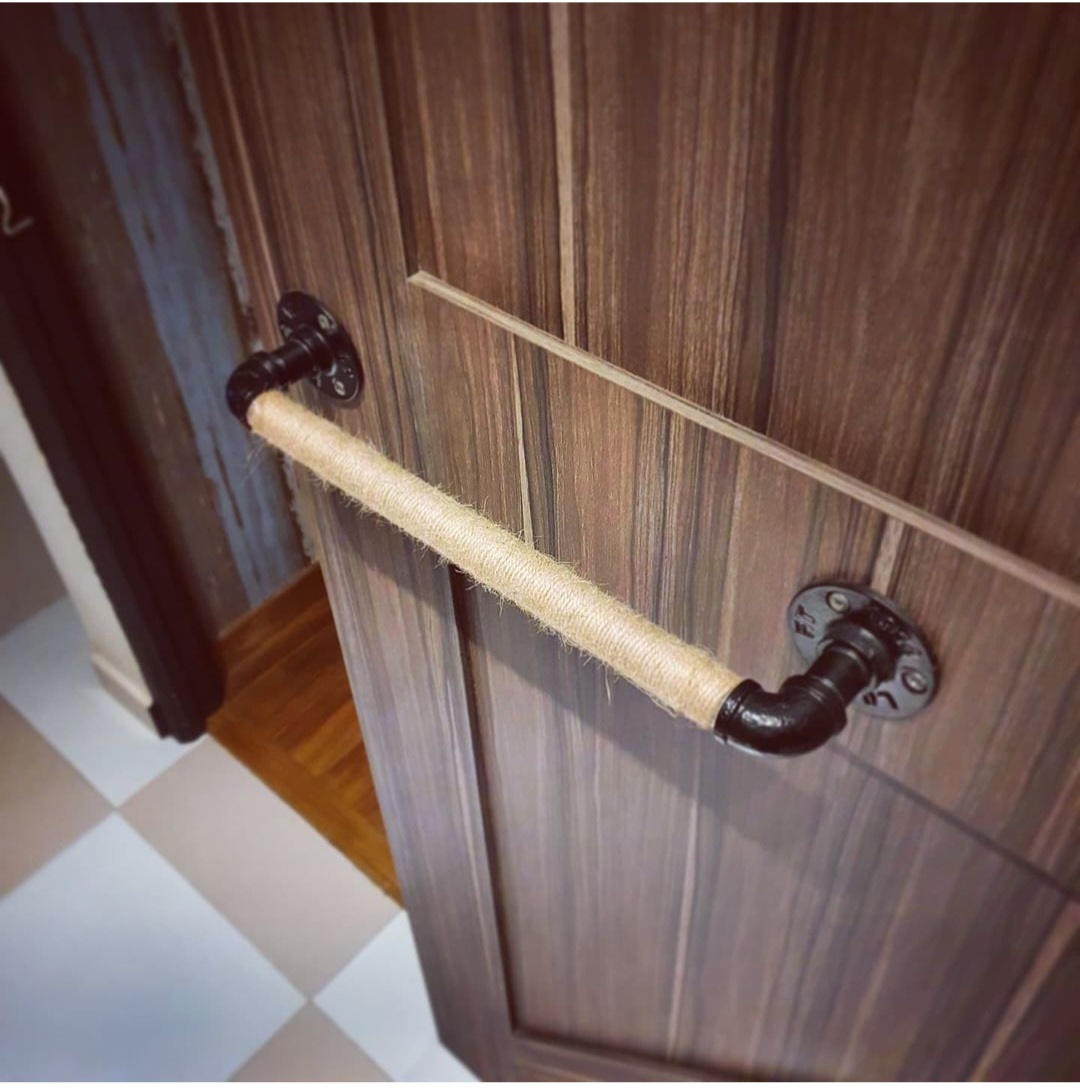 Cosy Escapade - wooden cabinet, burlap cord, rustic charm, black hardware, wooden texture, vertical panel, wooden door