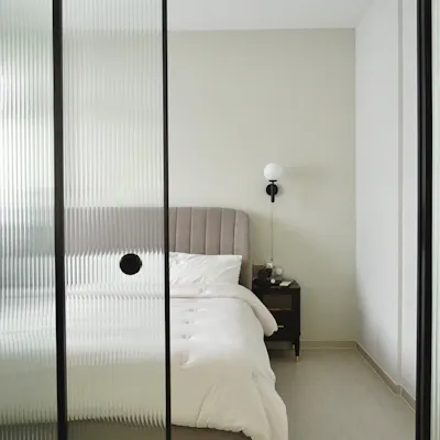 Customer home photo 3: Our bedroom; the room behind the reeded glass doors