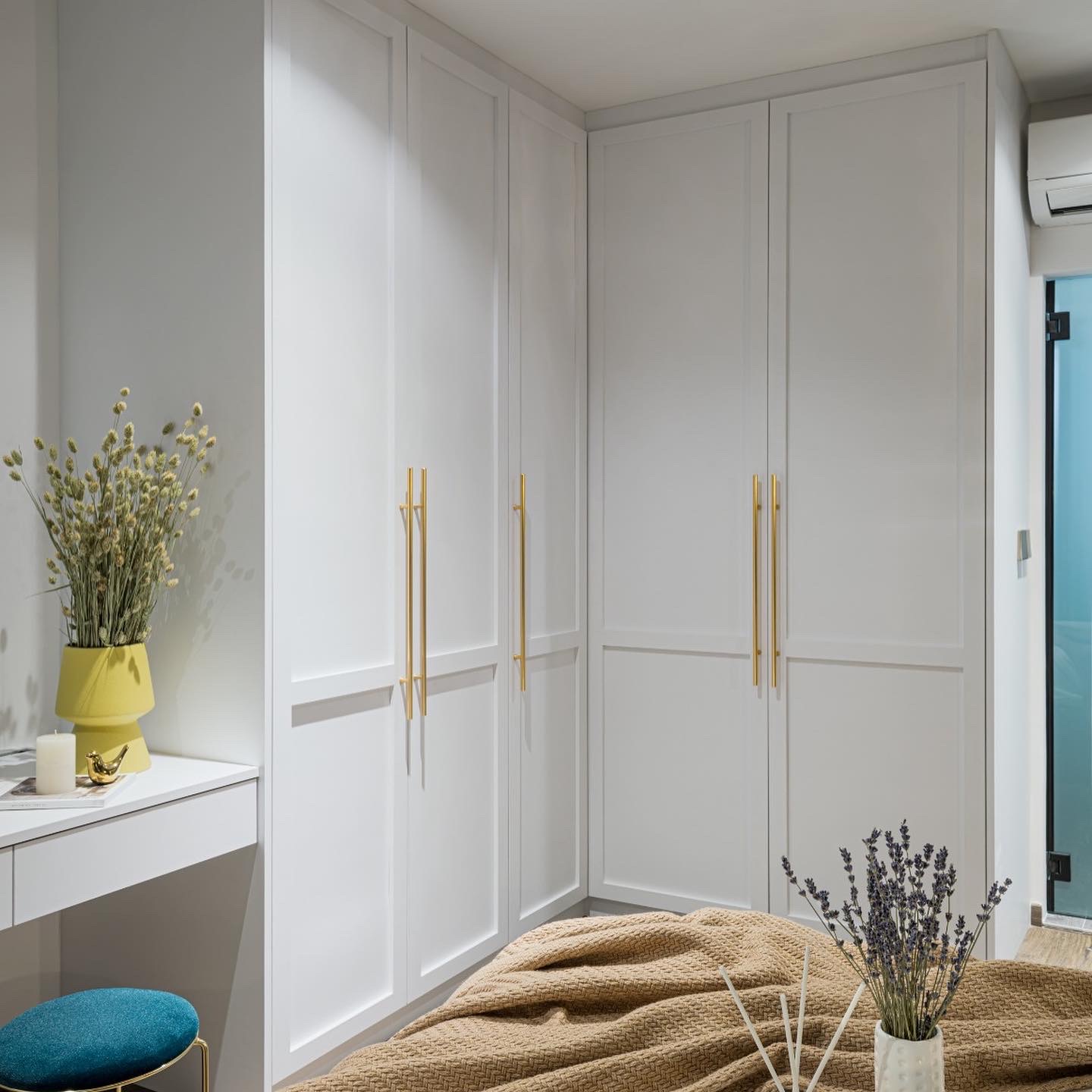 Cozy Bedroom - Nestled in comfort and warmth, where dreams take flight - White cabinetry with gold handles, minimalist