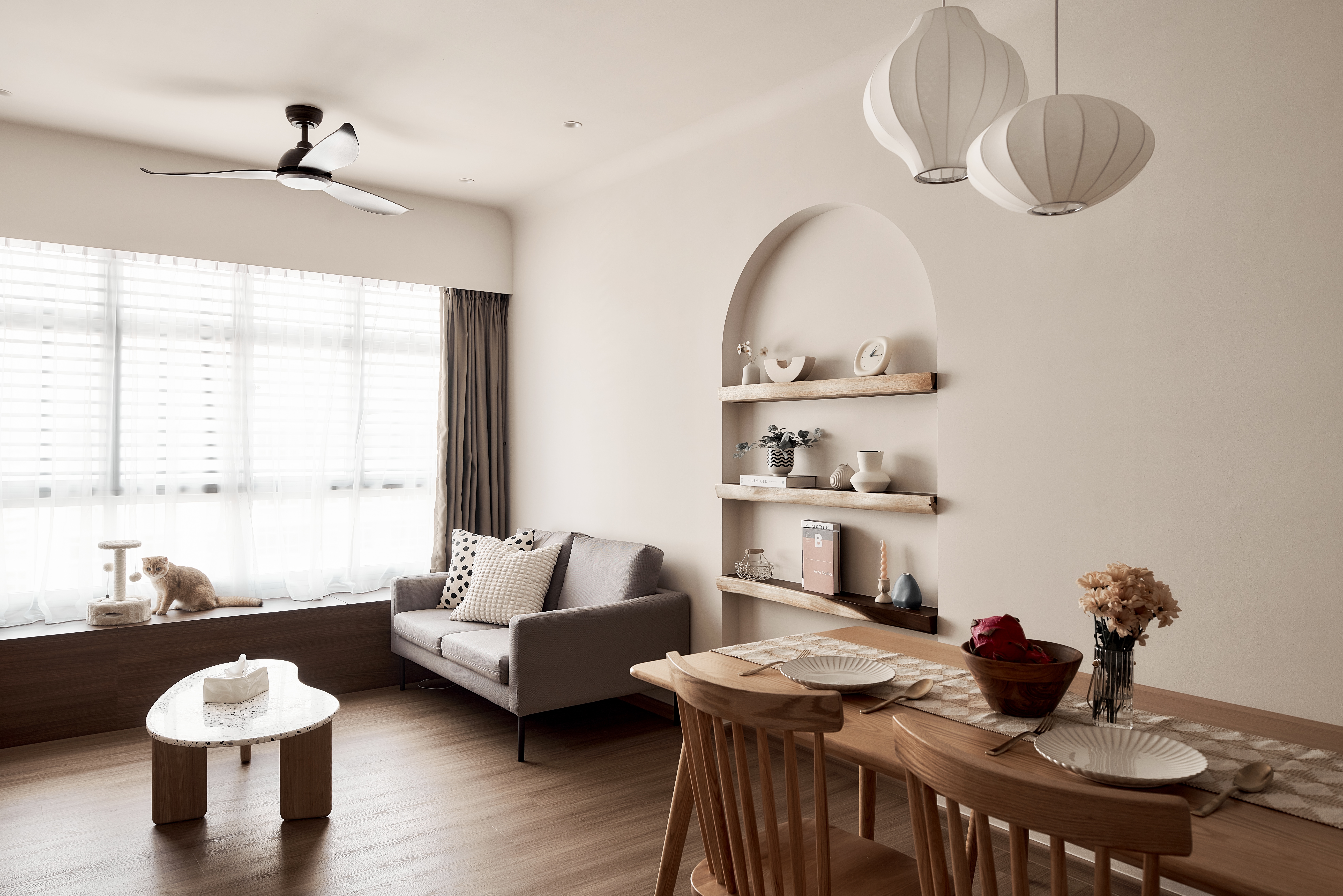 Living + Dining Space - Small but perfect for 2 - Modern minimalist living room with cat on windowsill, soft natural light