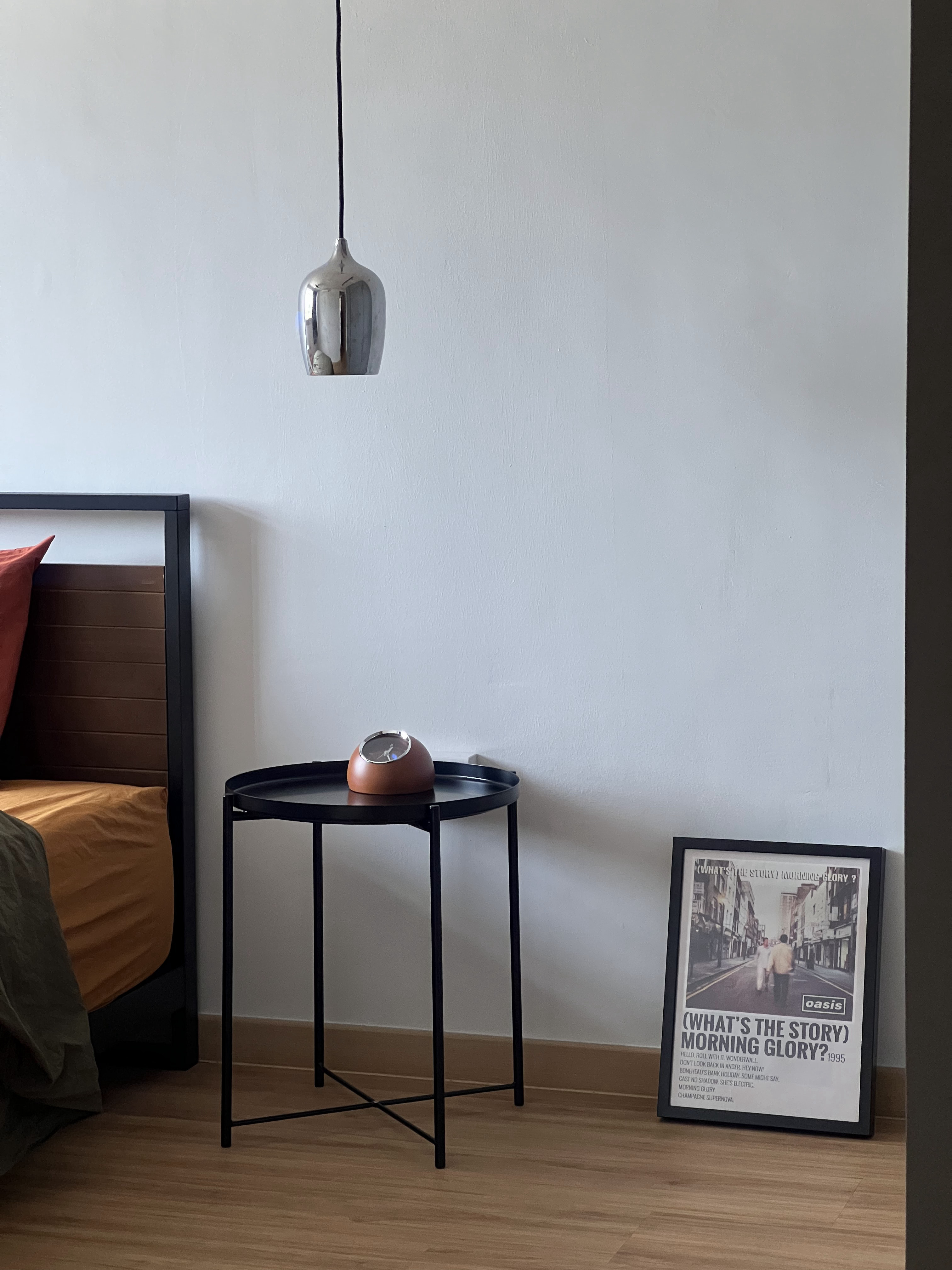 Rise and Rest: A Simple Bedroom Designed for Naps and More Naps - modern bedroom, minimalist decor, black metal table, orange