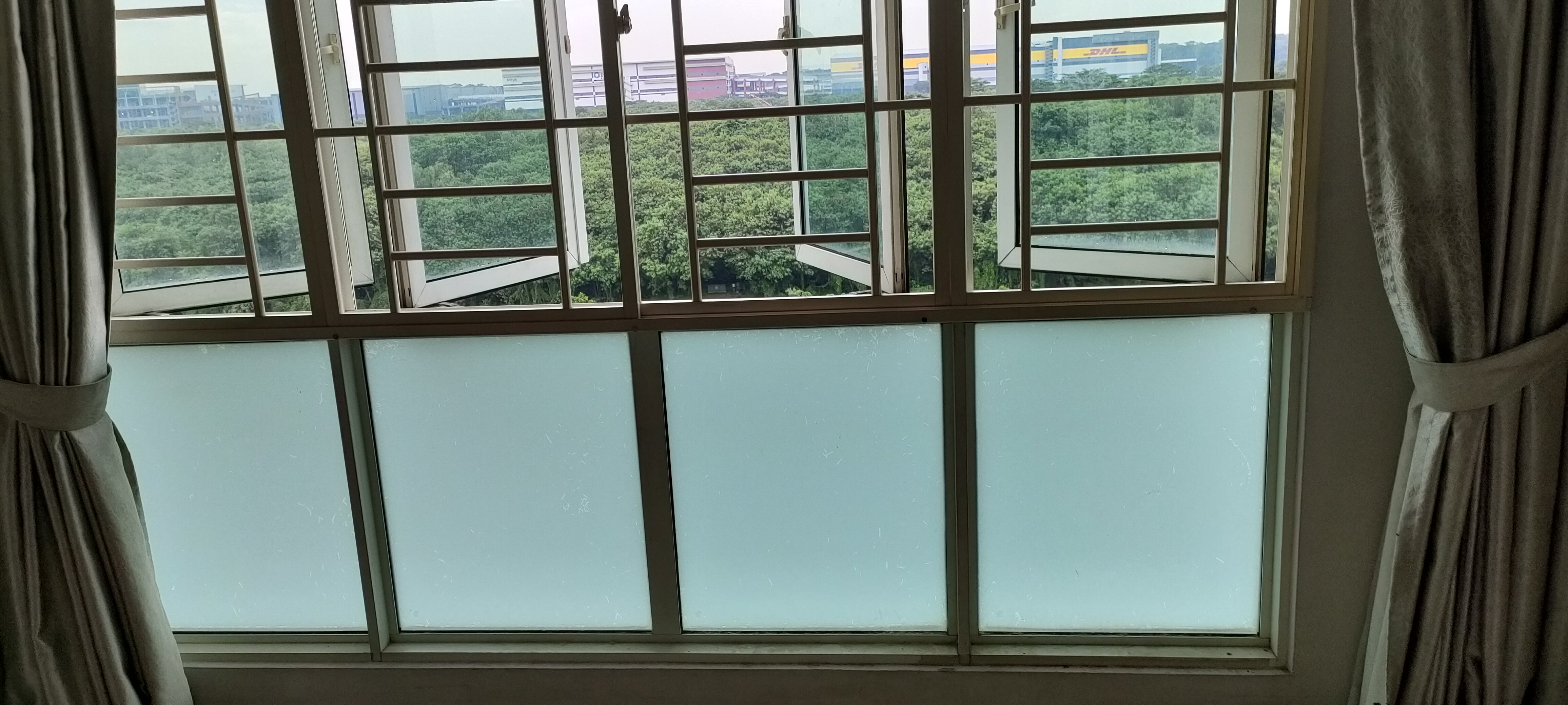 No Gardenspace for us! - Large windows, view, green trees, industrial buildings, cloudy sky, indoor setting, curtains, sheer