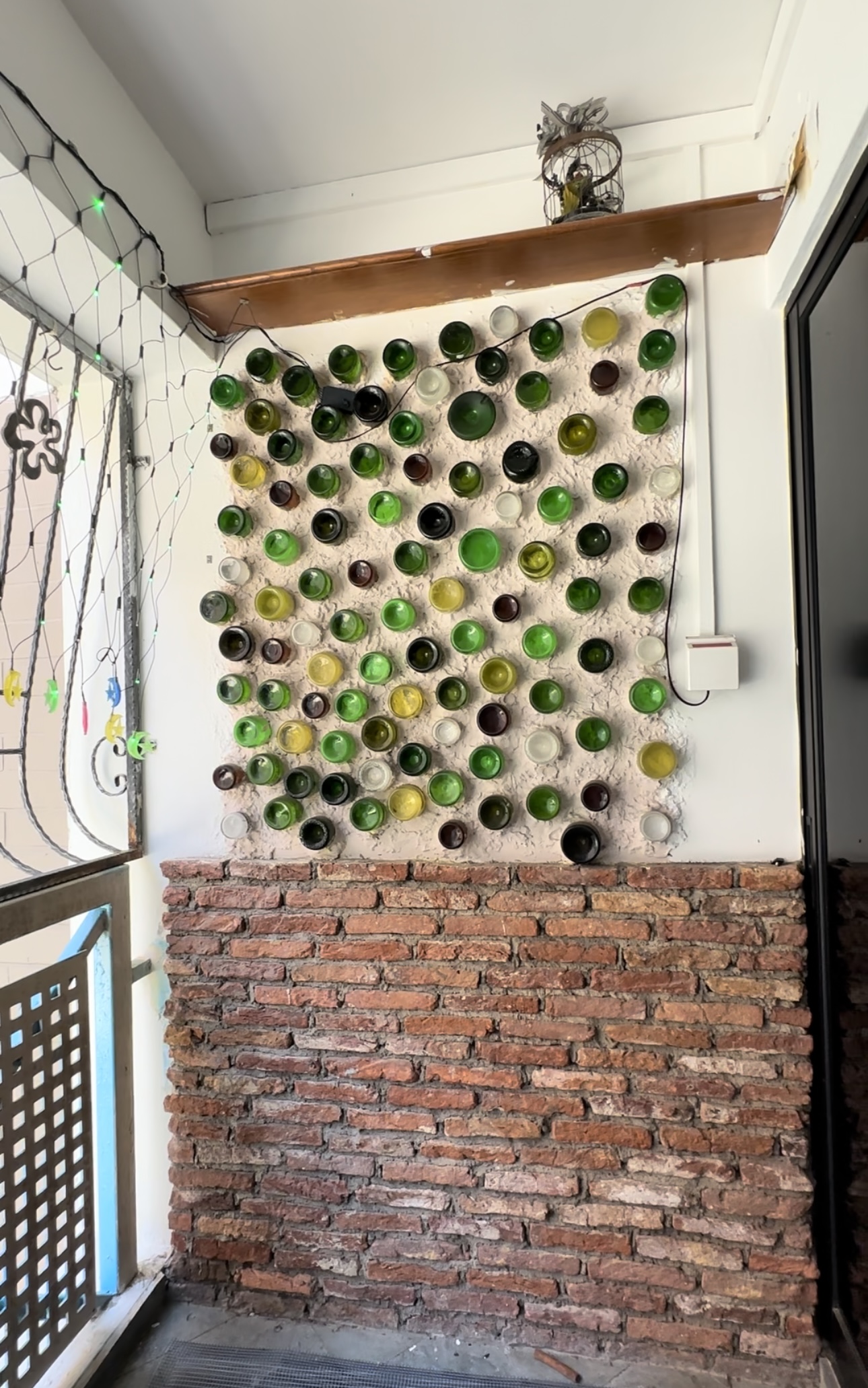 Verde Nook & Vertical Garden - Bottle wall art, colorful bottles, brick wall, decorative glass bottles, hanging decorations