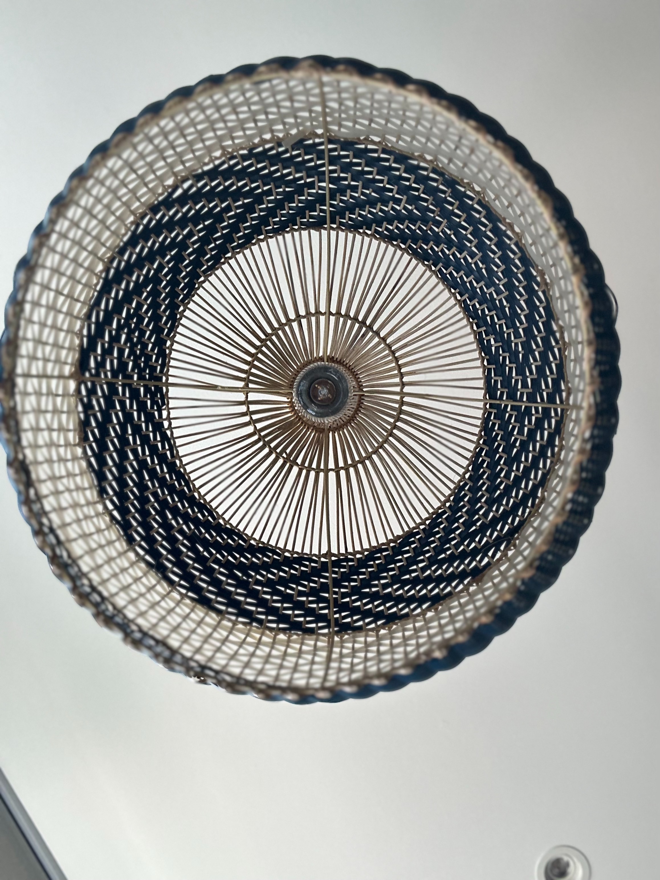 Dining space 🍷✨ - Dome-shaped ceiling light fixture, intricate woven design, circular pattern, metal frame, warm-toned