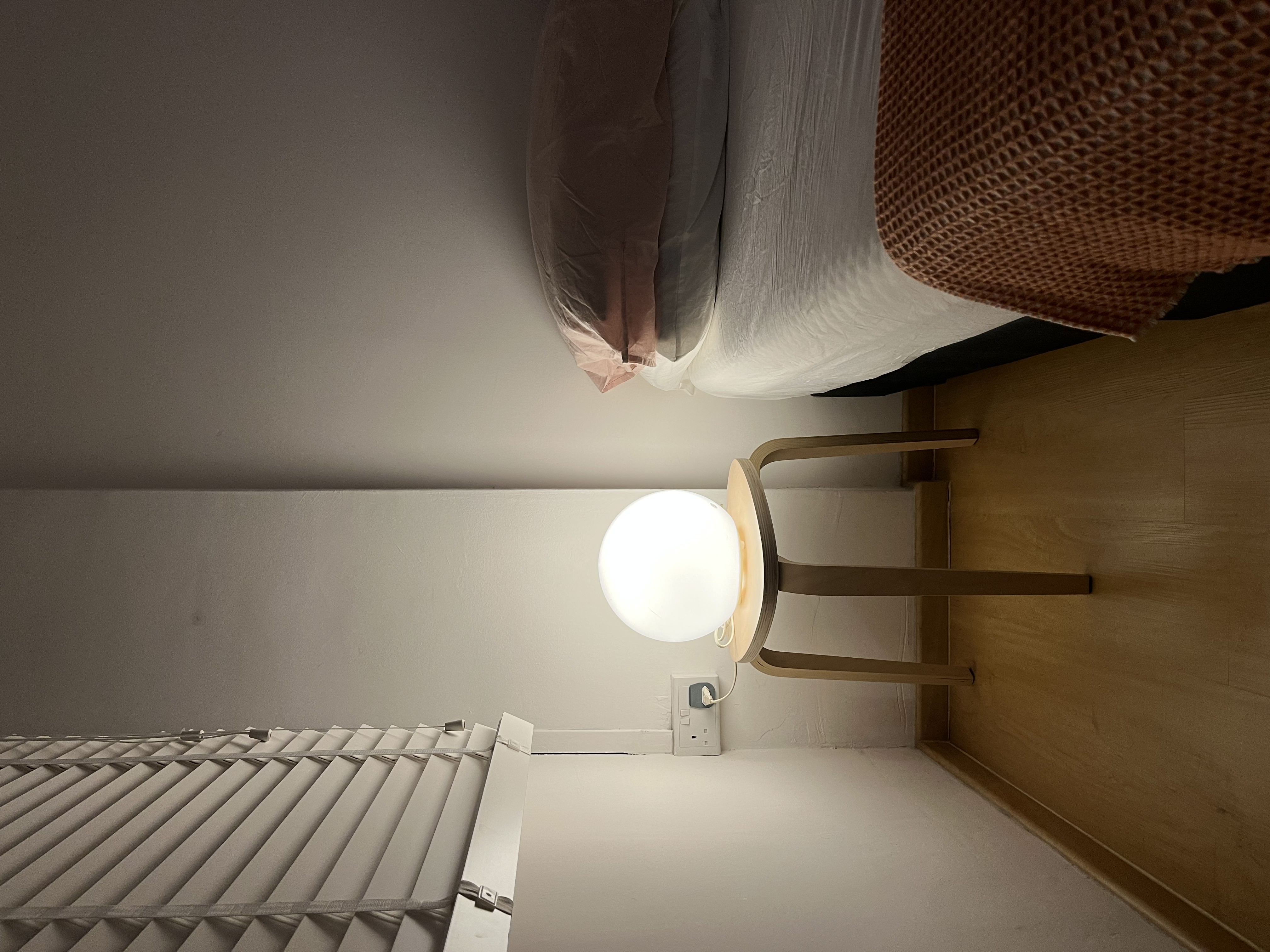 The Zen Zone: A Peek into Our Peaceful Retreat - modern bedroom, cozy corner, minimalist design, soft lighting, wooden floor