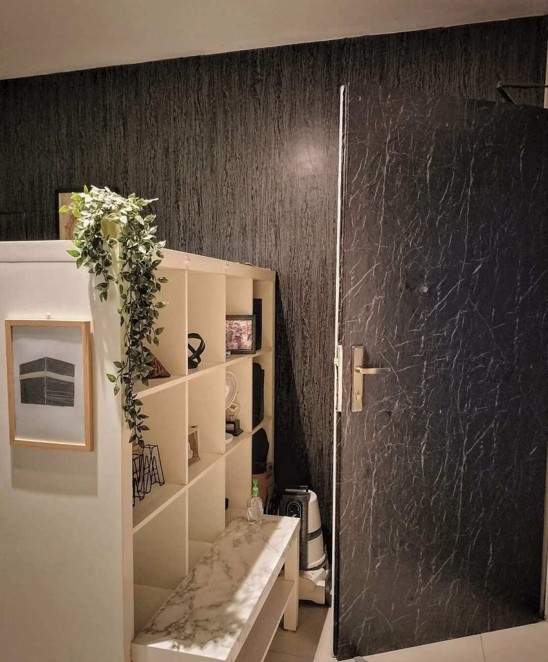 The DIY ENTRANCE - Shelf with decorative items, framed picture, indoor plant, marble wall, modern decor, minimalist design