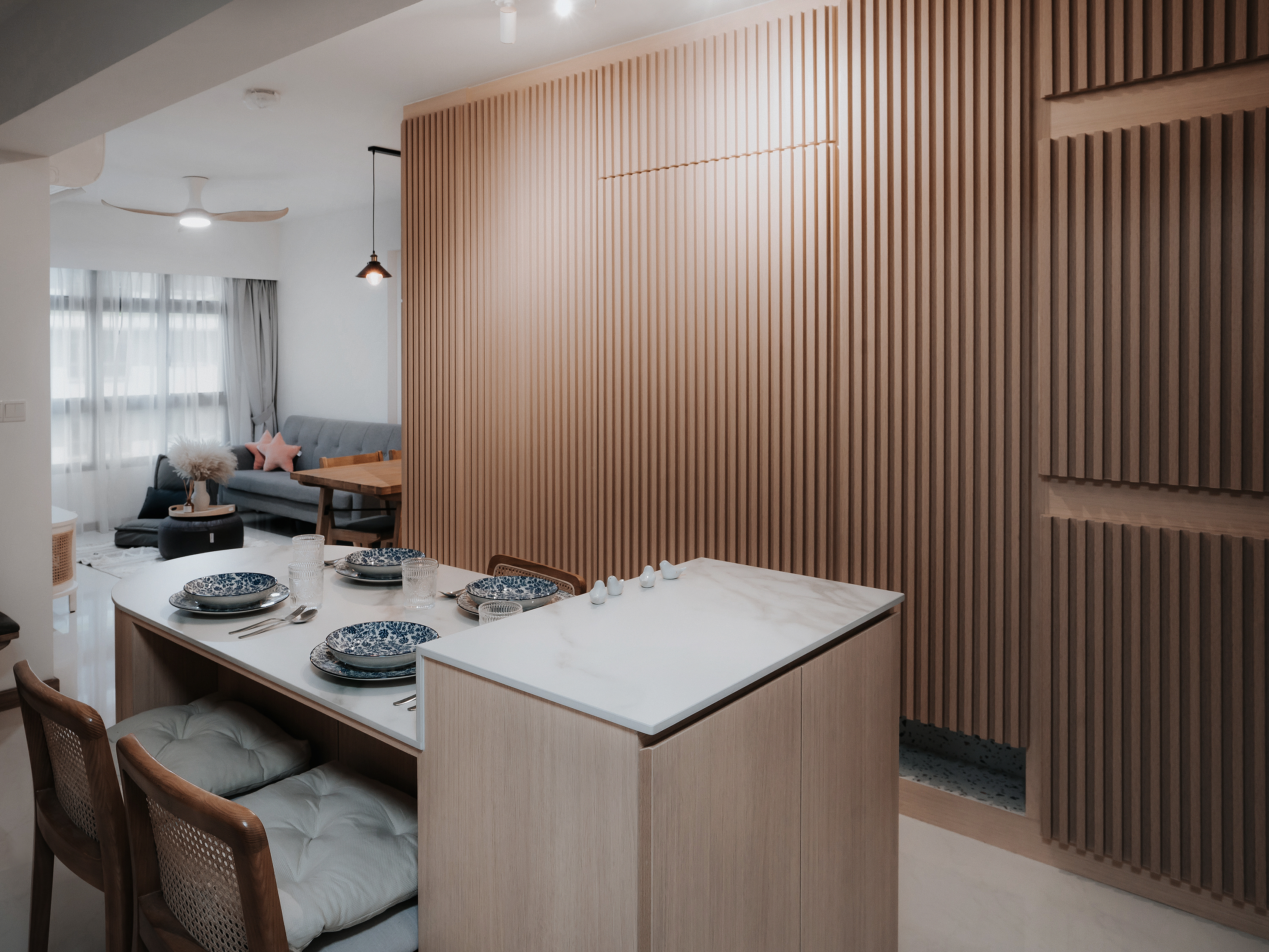 We do Dining but on the Move - Modern dining room with wooden paneling, minimalist furniture, dining table with blue