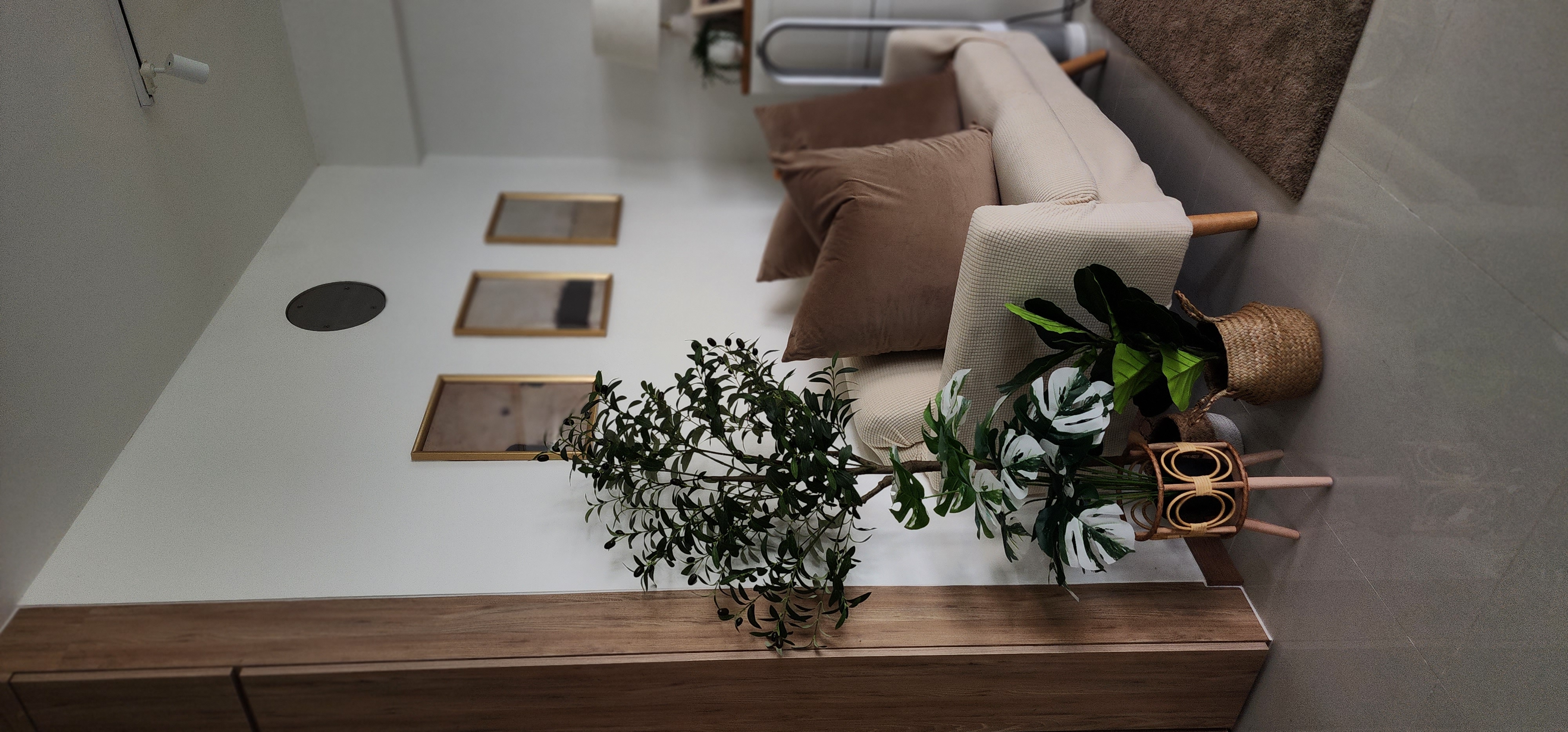 May the Faux be with us!  - modern living room, minimalist decor, cozy seating area, beige sofa, brown cushions, wooden