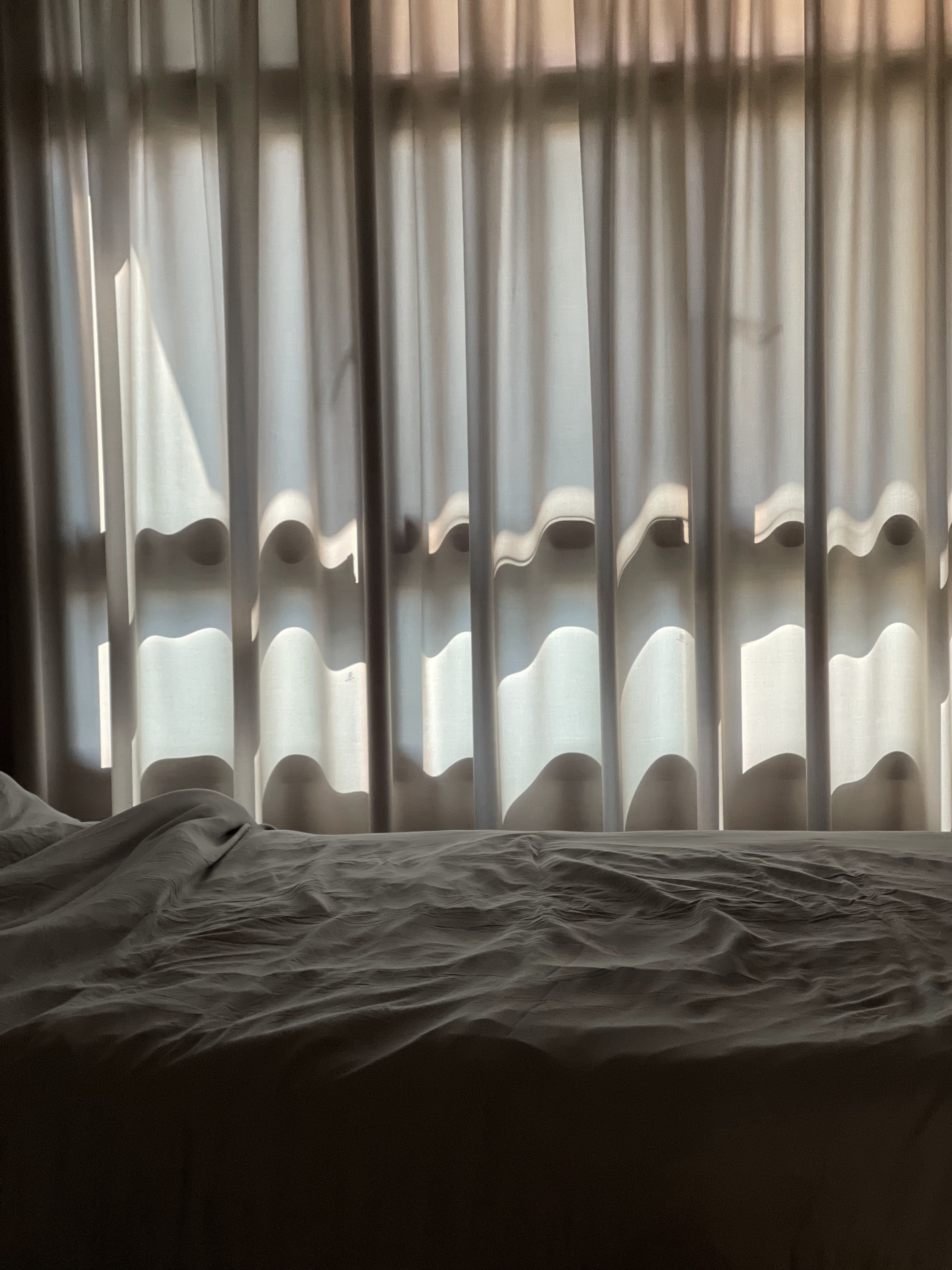 Our Atypical Master Bedroom: No L-shaped Wardrobe for us - Soft, diffused light filtering through sheer curtains, creating