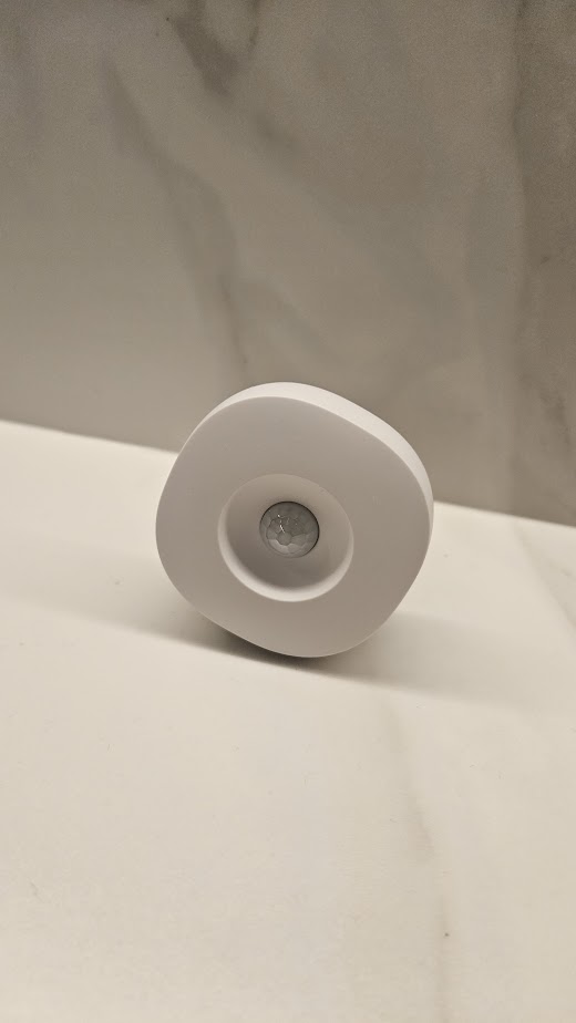 A Smart and Functional Kitchen - White cylindrical object, modern design, sleek surface, minimalistic background, floating on