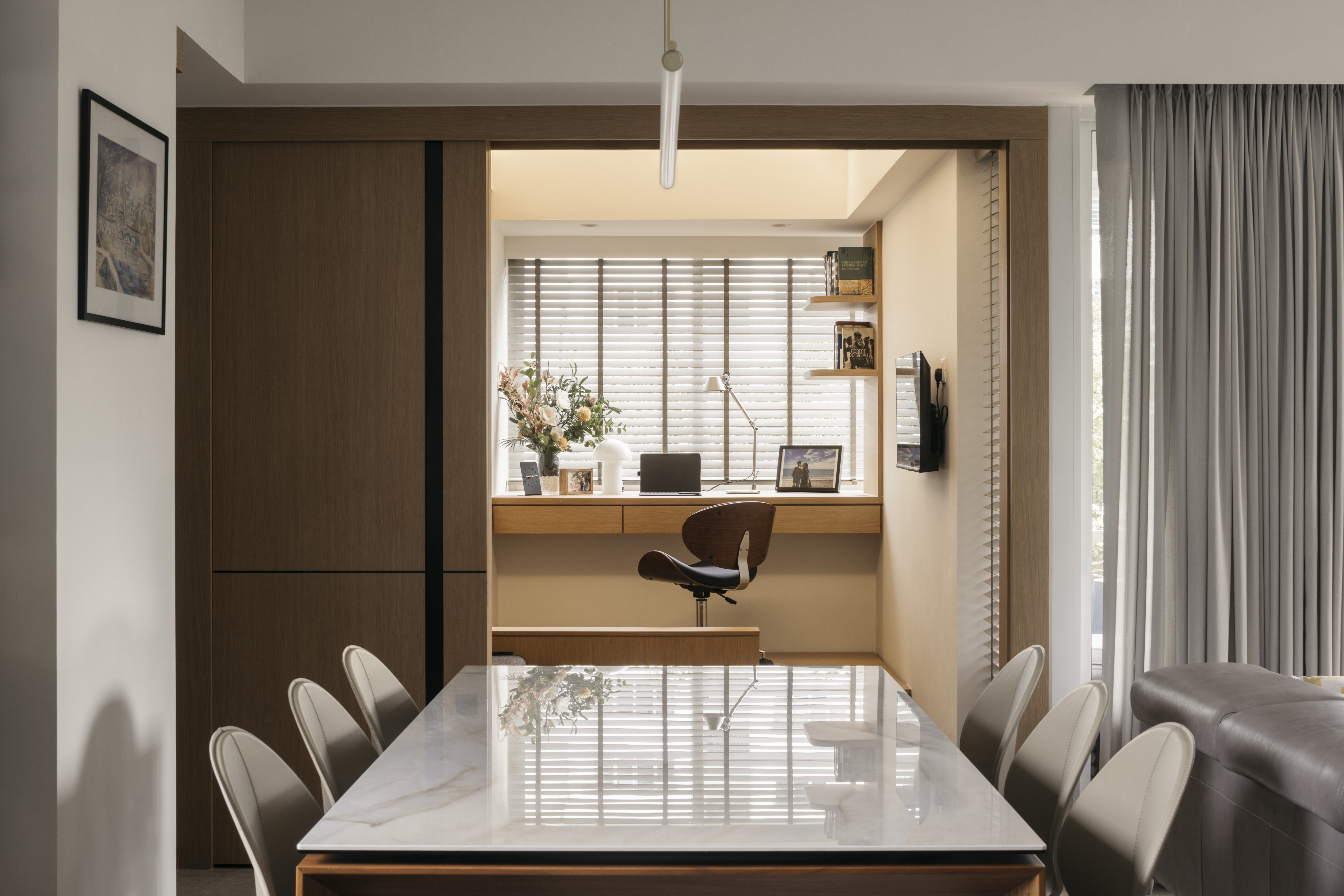 Redesigning an old condo unit to be inviting and warm - Modern home office with sleek furniture, minimalist design, large