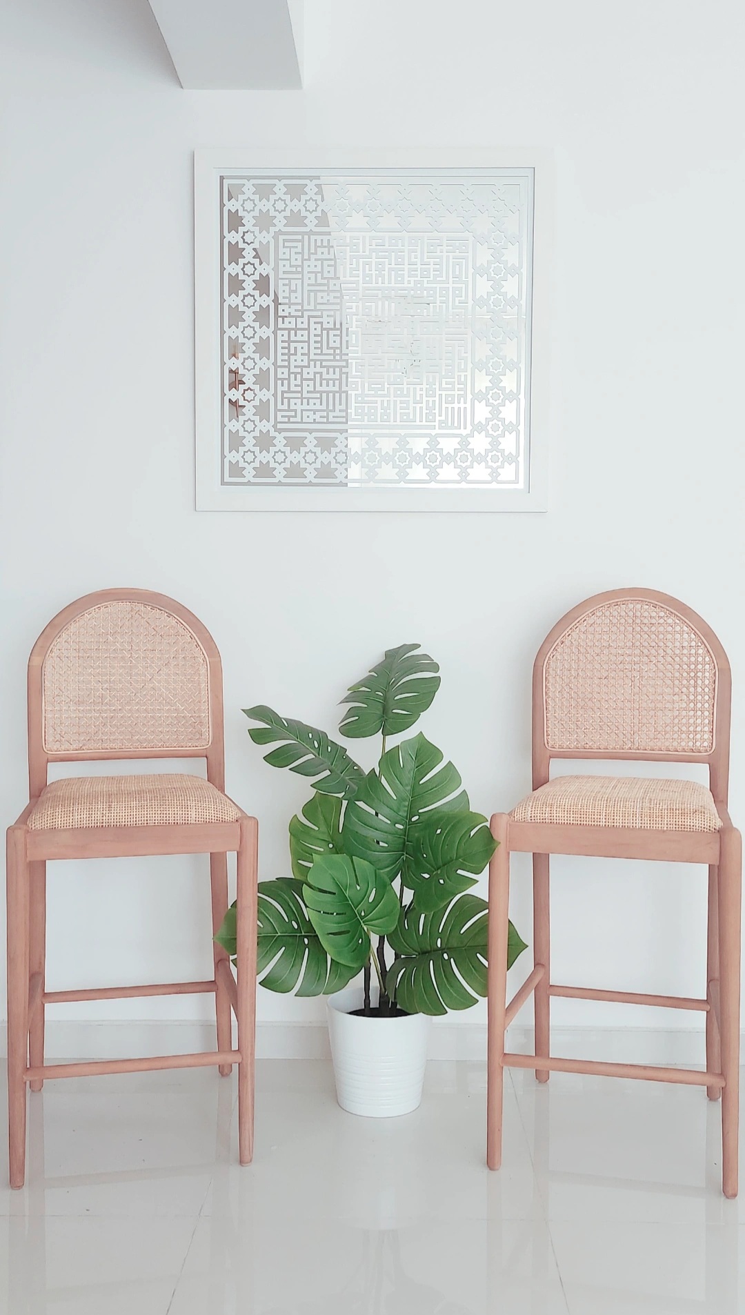 Move-a-round plants - Woven chair, minimalist design, natural wood finish, rattan seat, white wall, geometric pattern, modern