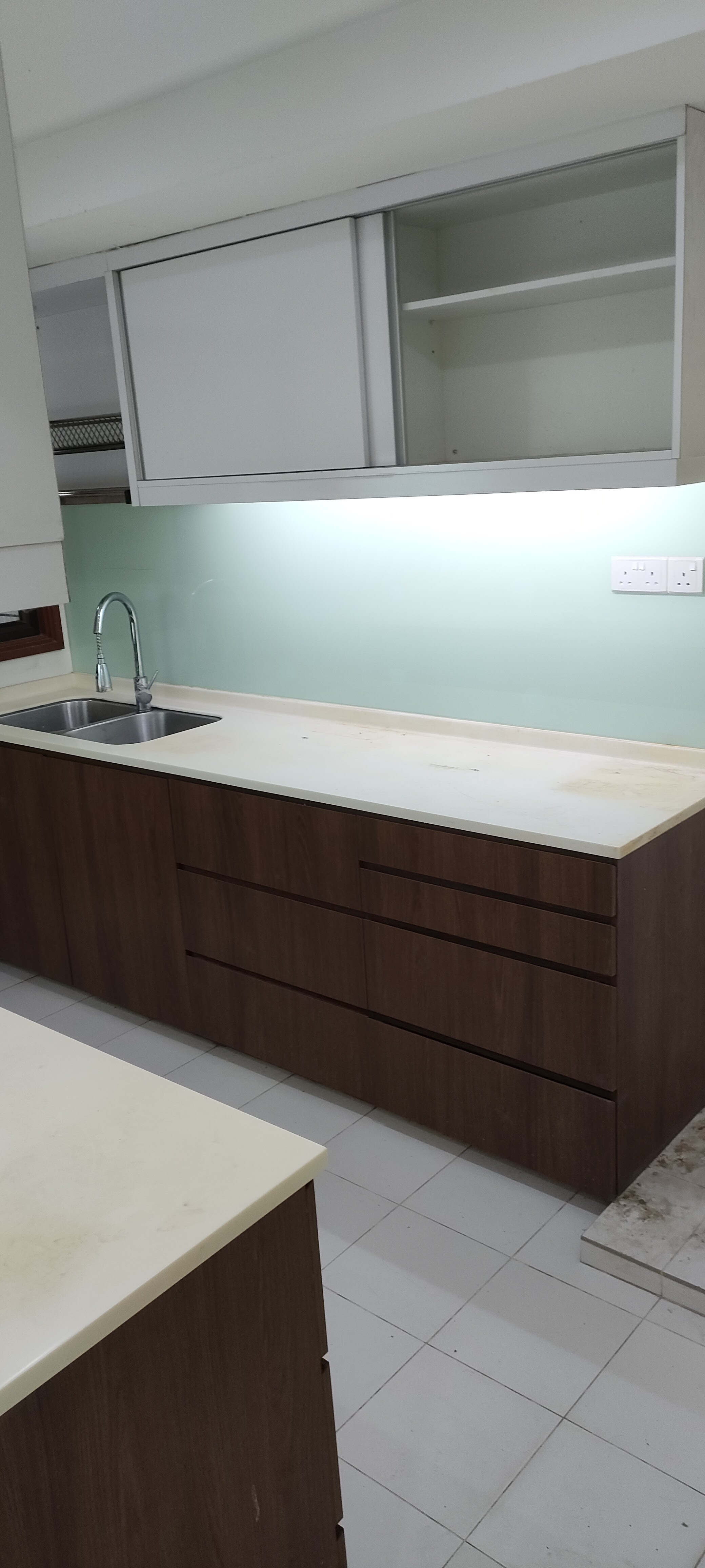 the heart of our home--Our kitchen! - Modern kitchen with sleek design, white countertops, dark wood cabinetry, stainless