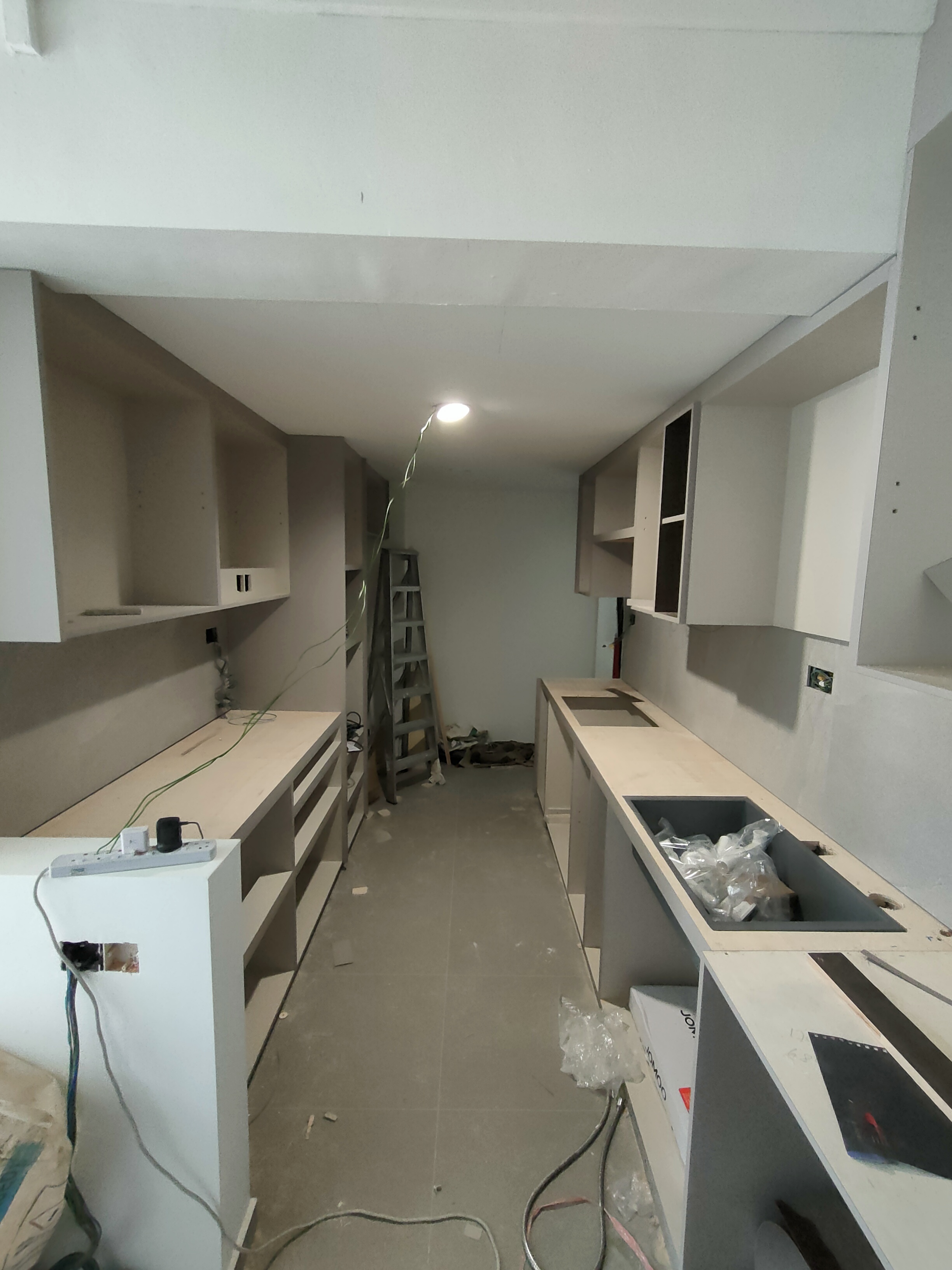 the heart of our home--Our kitchen! - Kitchen cabinetry, unfinished countertops, white cabinets, open shelves, ladder