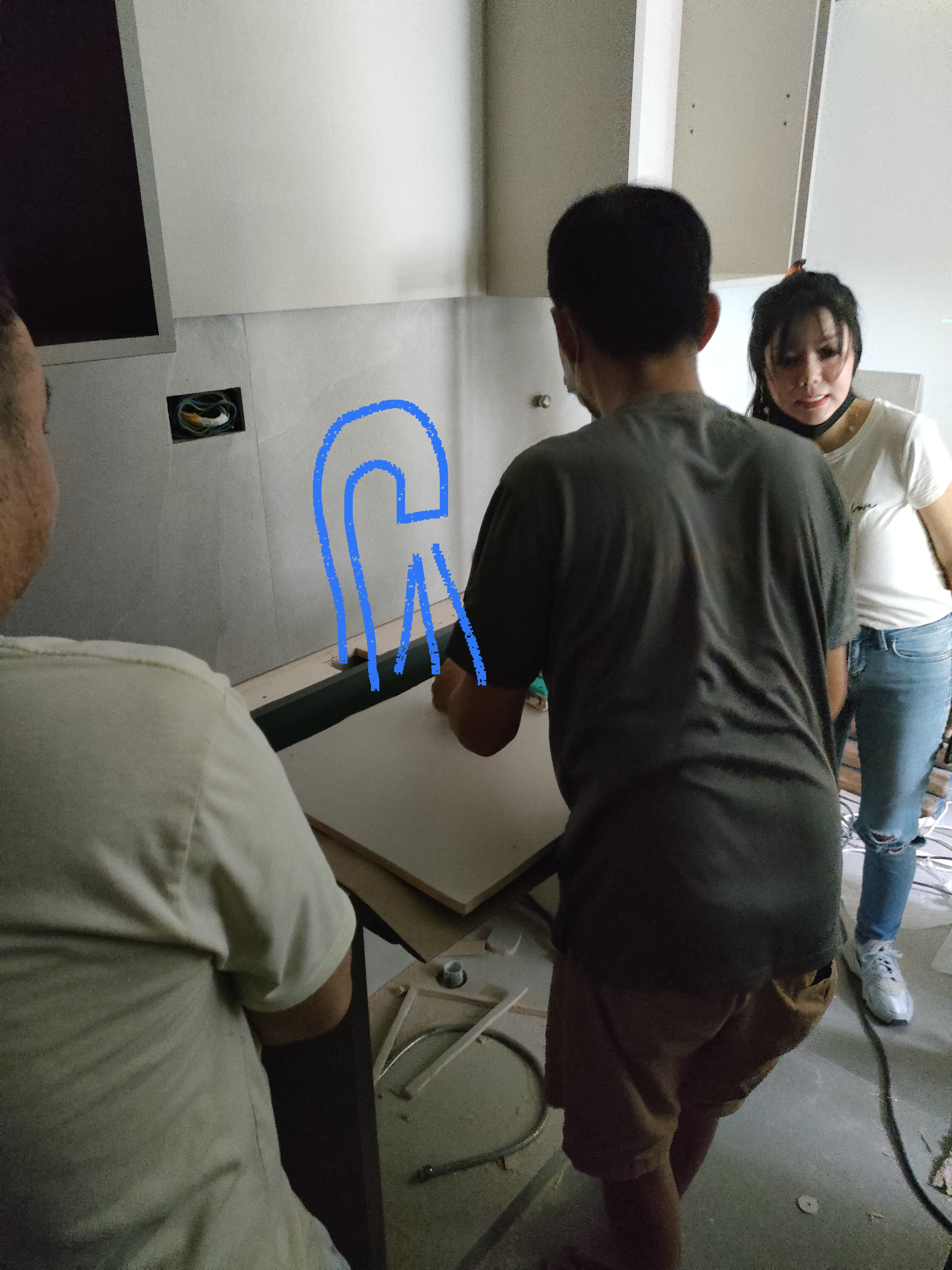 the heart of our home--Our kitchen! - Group of people working on a construction project, focusing on a wooden plank on a
