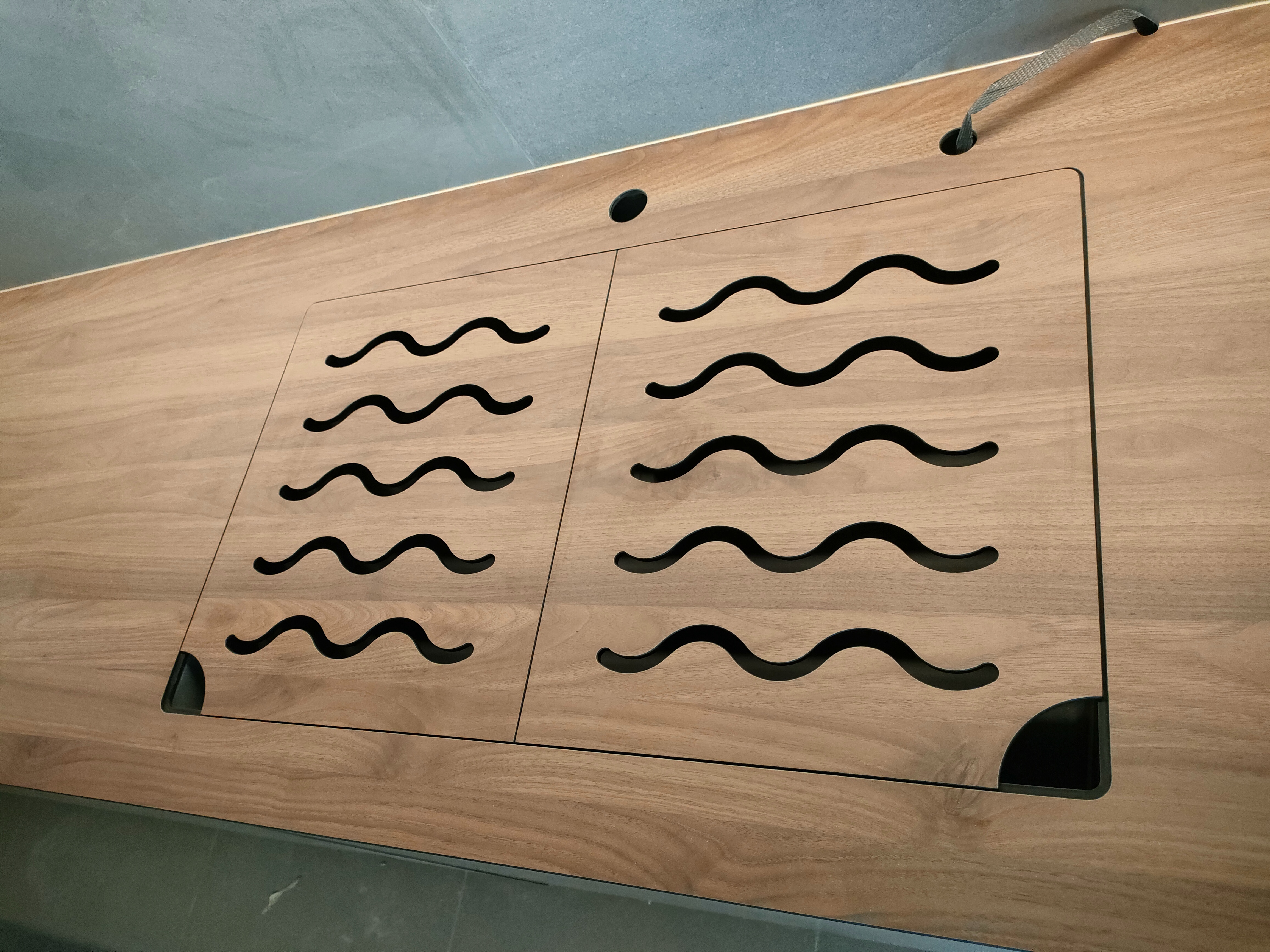 the heart of our home--Our kitchen! - Wooden surface with wavy black designs, rectangular panels, black cutouts, minimalist