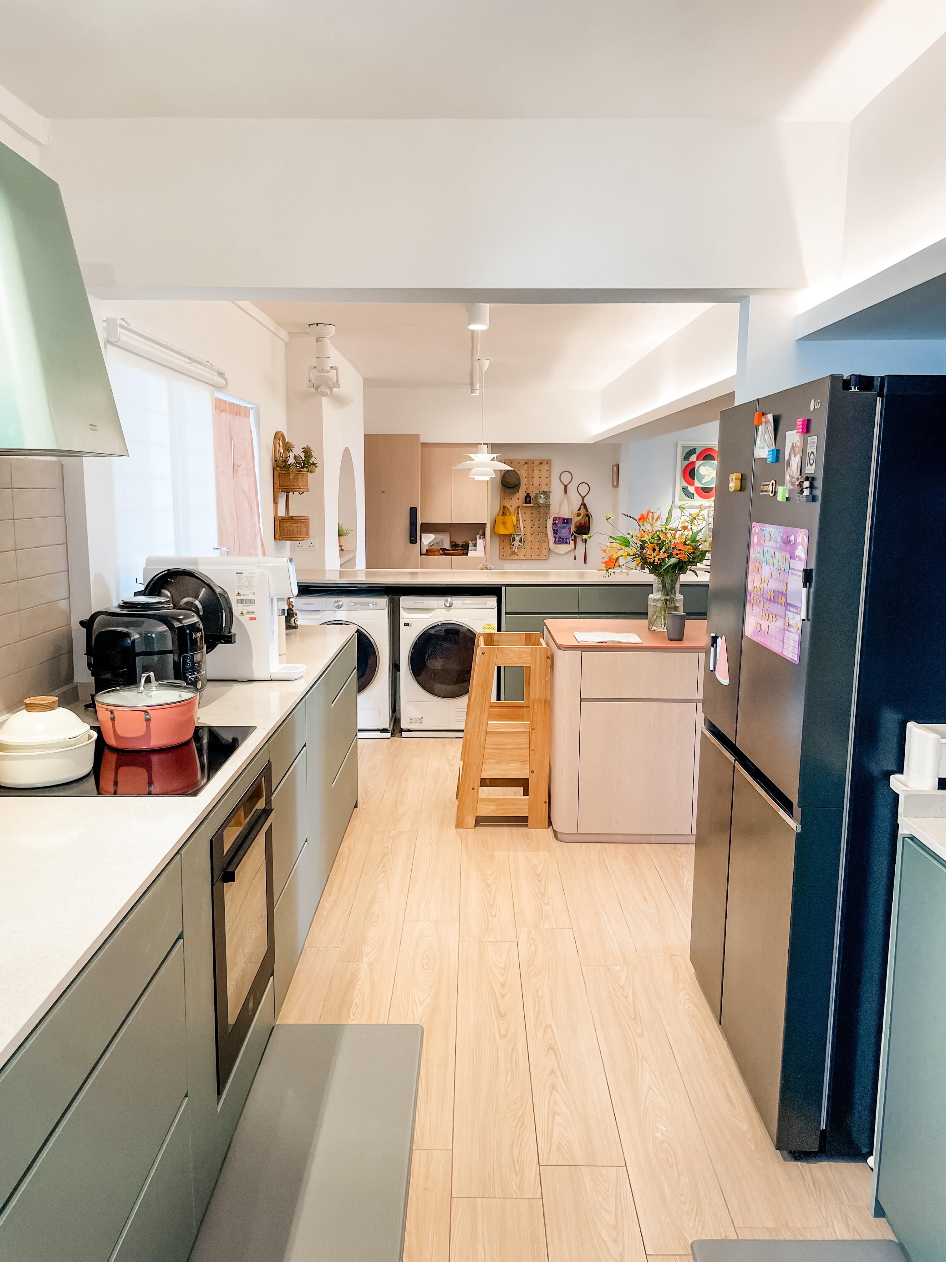 An Open-Plan Kitchen With A Secret "Mama Shop"  - Modern kitchen with stainless steel appliances, light wood flooring, white