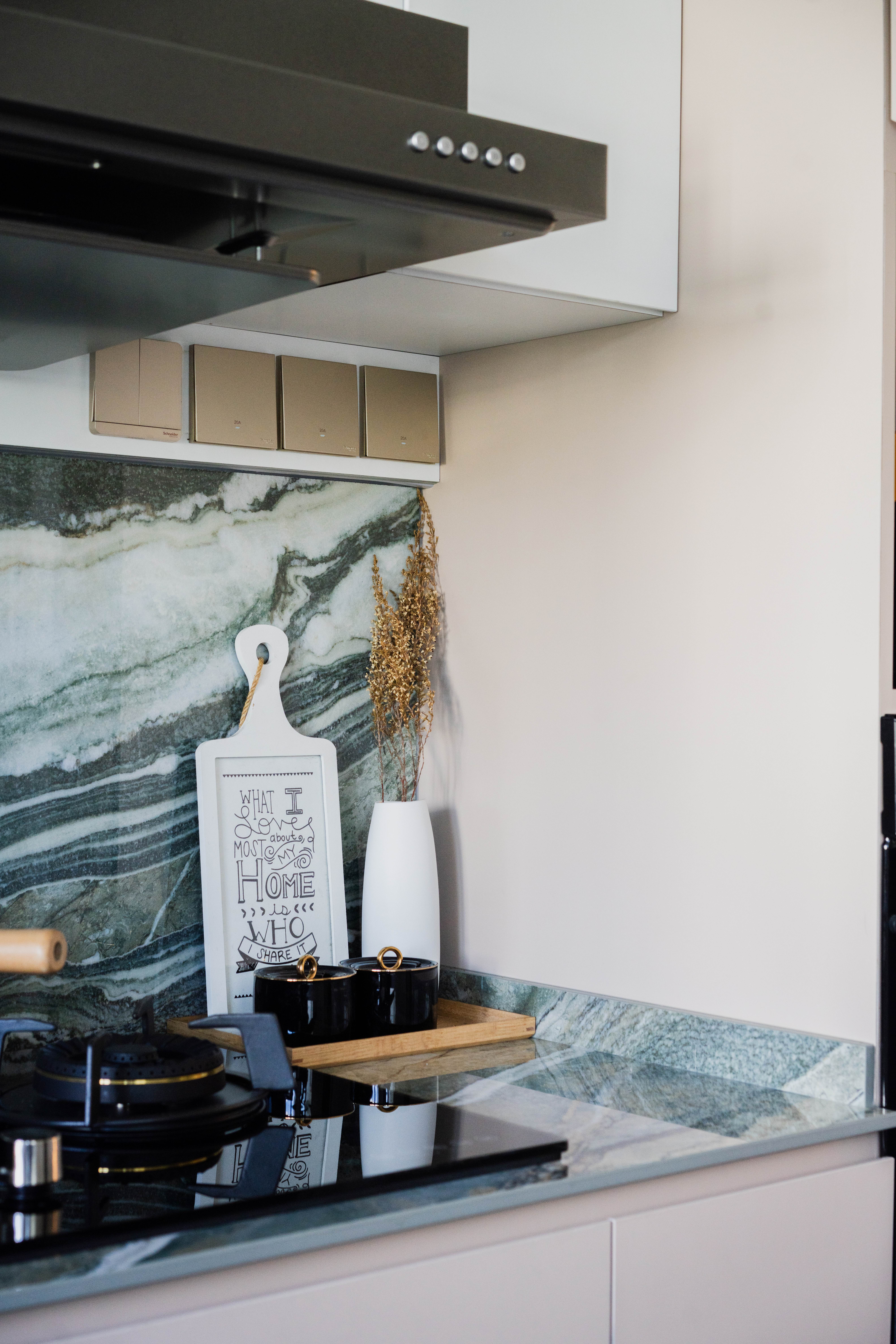 Kitchen Edition//  Terrazzo & Nature-Inspired Royal Peacock Marble - Marble backsplash, modern kitchen, black stovetop, white