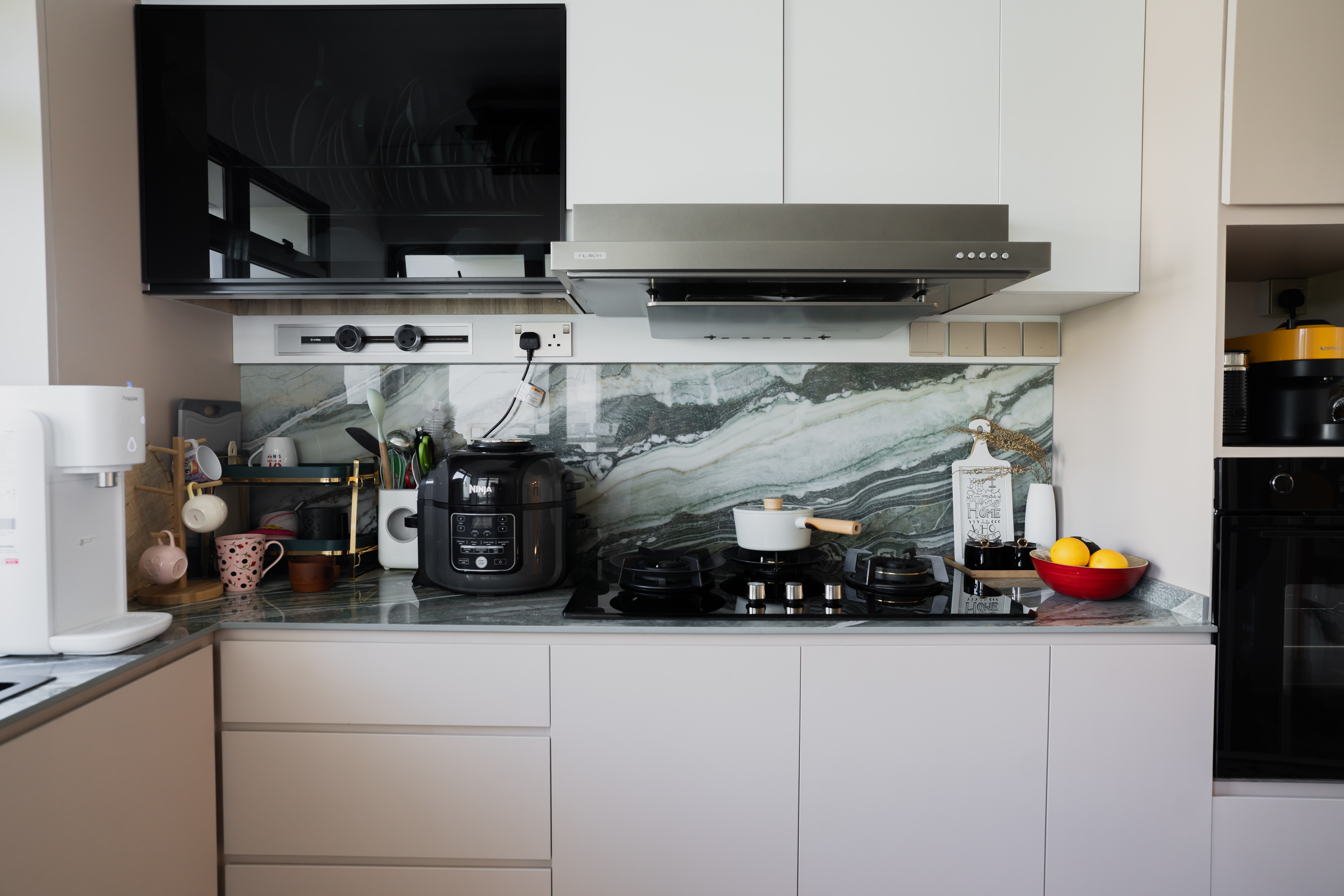 Kitchen Edition//  Terrazzo & Nature-Inspired Royal Peacock Marble - Modern kitchen with black microwave, white cabinets