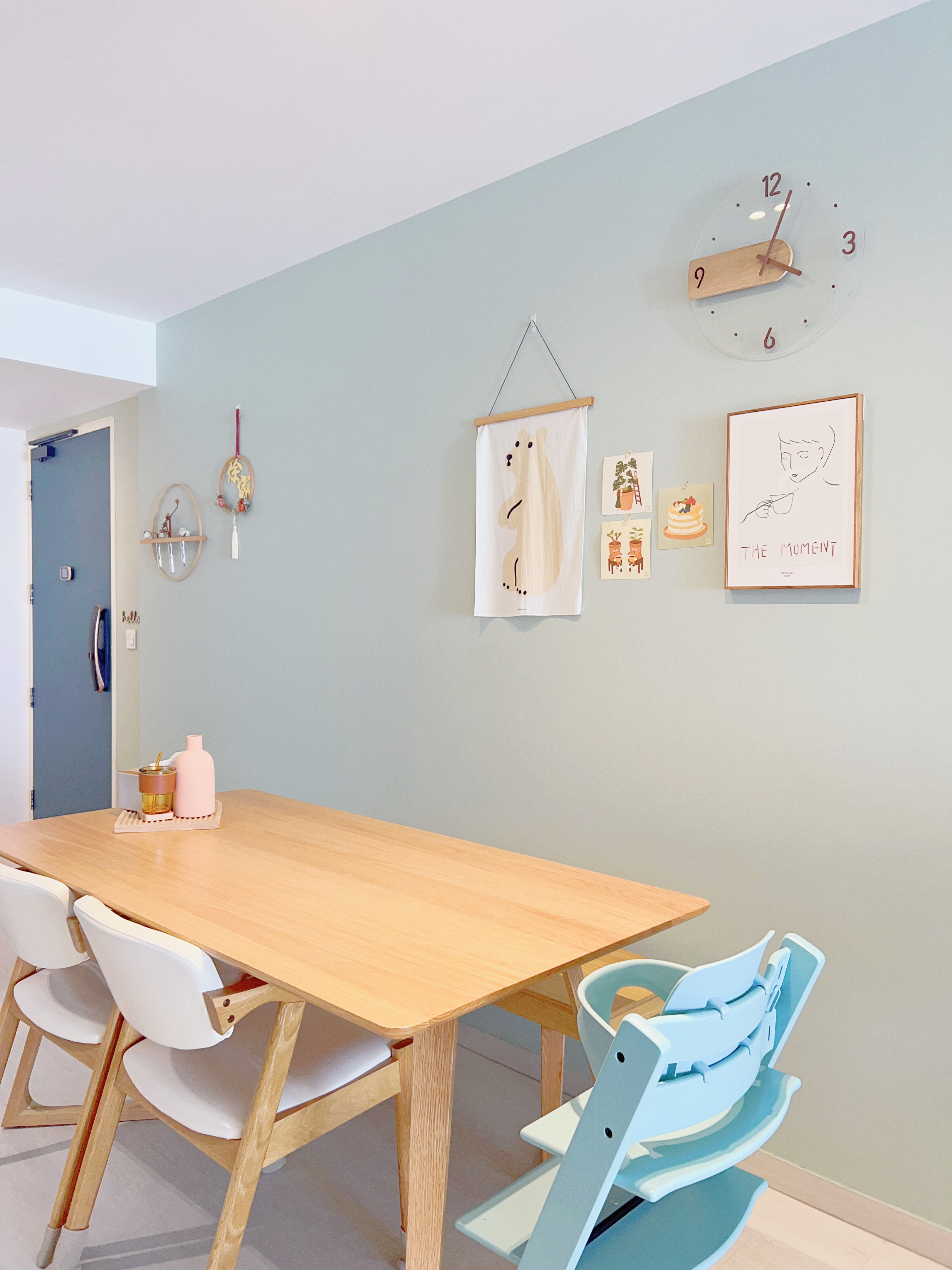 Turn Your Home into a Green Paradise.. Without Actual Plants! - Light blue wall, minimalist dining room, wooden table, white