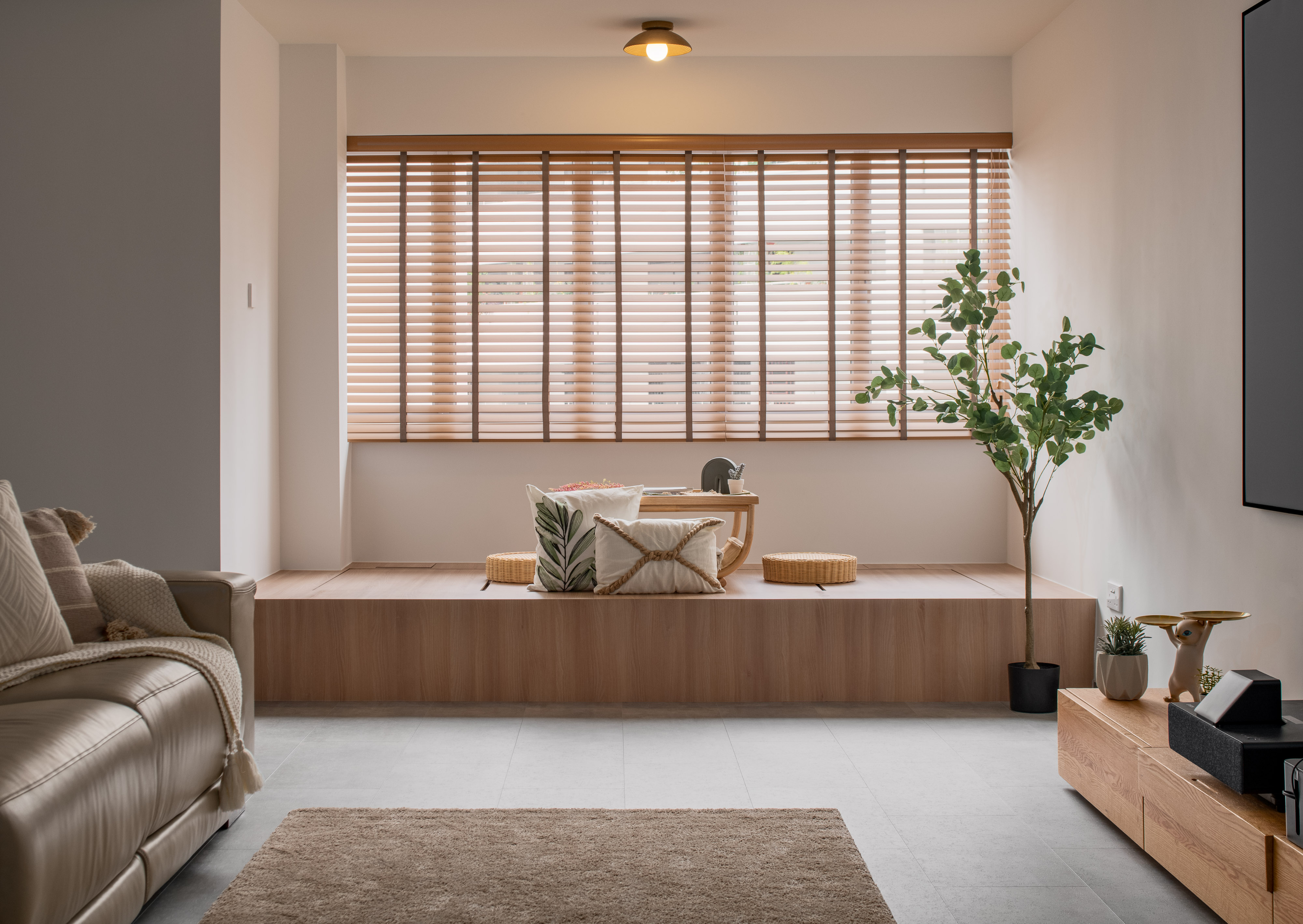 Embracing Japandi Design for a Tranquil Oasis - Modern living room, cozy seating area, minimalist decor, large window, wooden