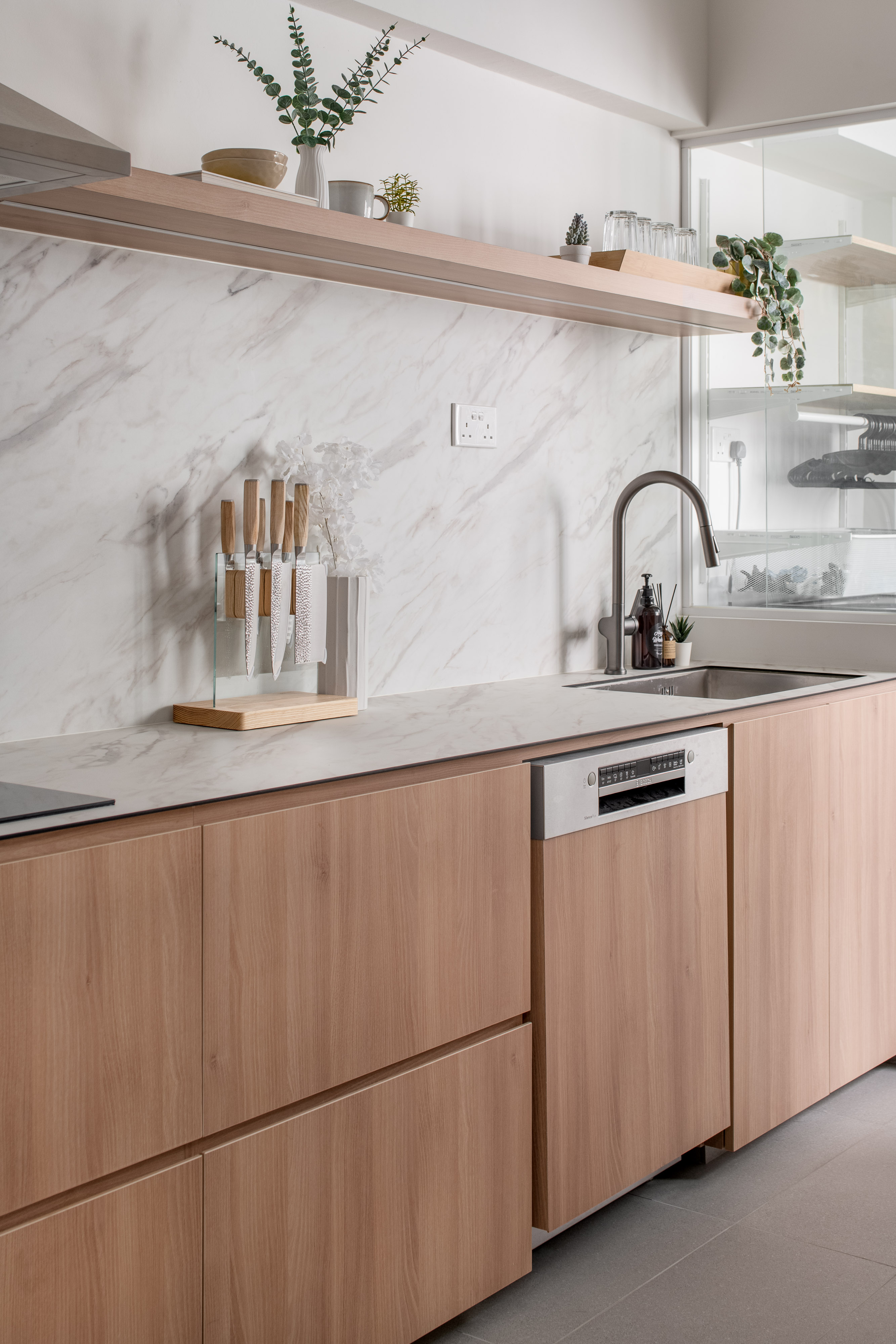 Embracing Japandi Design for a Tranquil Oasis - Modern kitchen countertop, minimalist design, wooden cabinets, marble