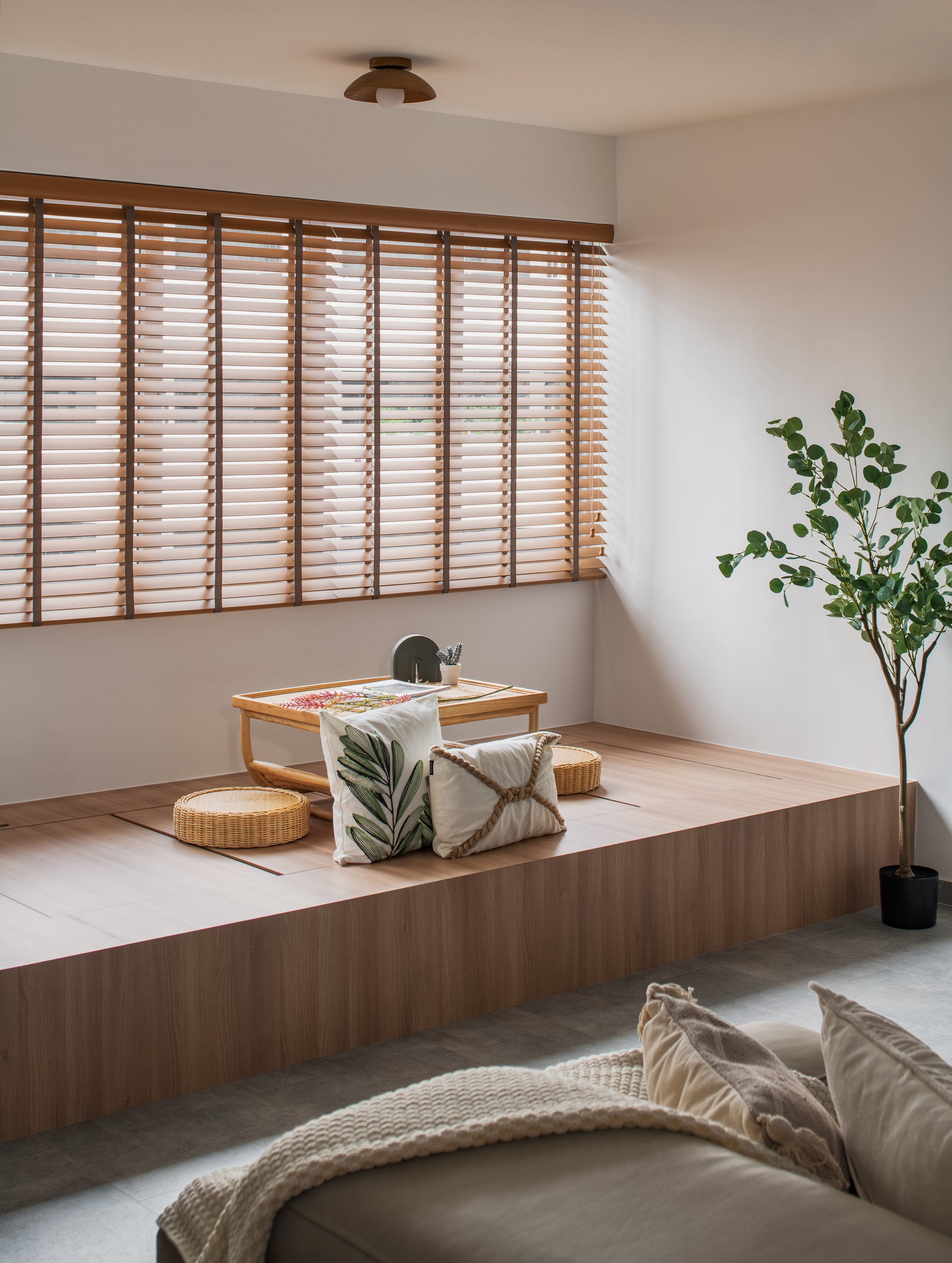 Embracing Japandi Design for a Tranquil Oasis - Wooden floor, modern living room, minimalist decor, natural light, wooden