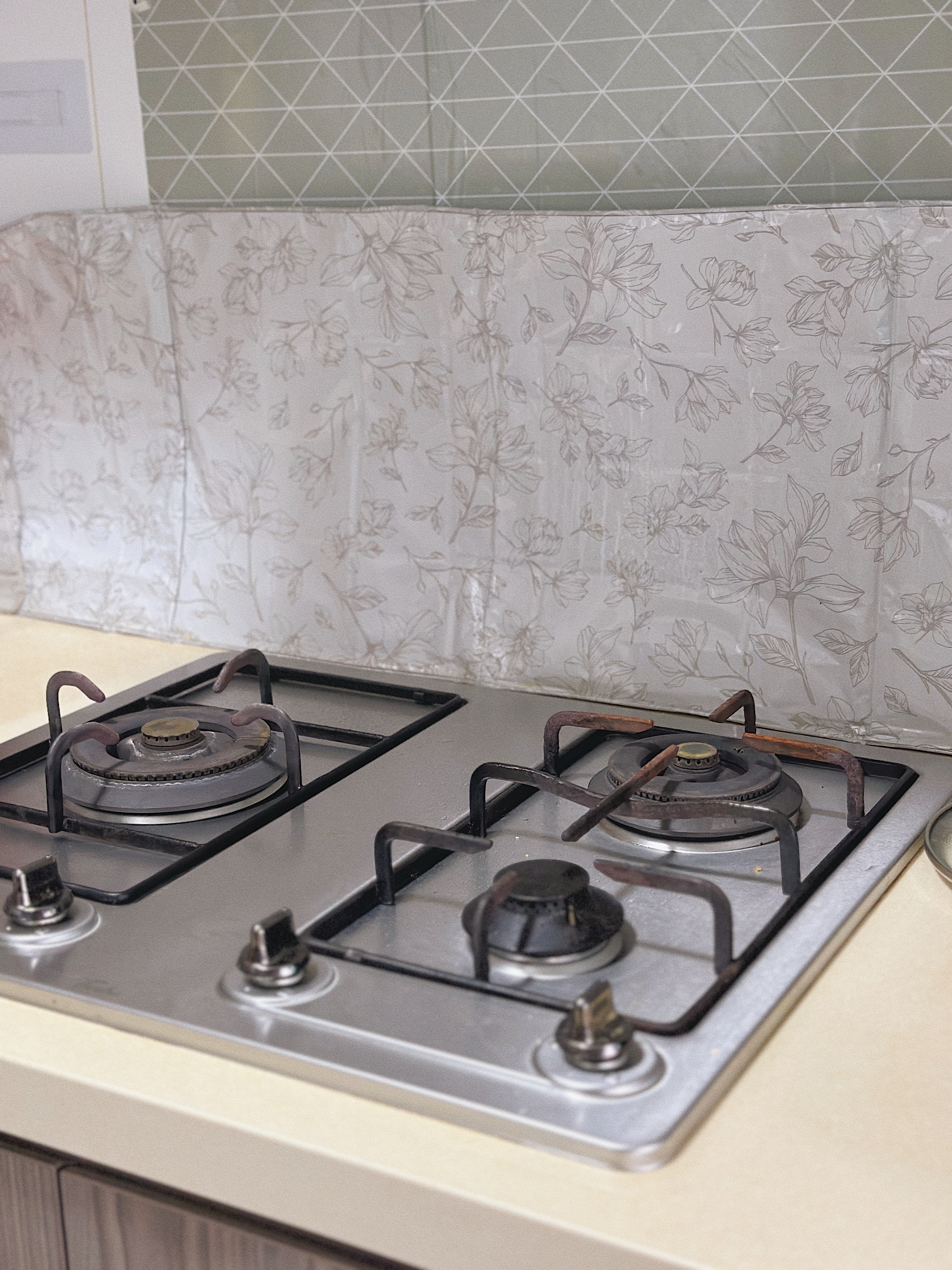 Love & Light: What Brings You Joy? - Gas stove with two burners, floral backsplash, old-fashioned design, metal components