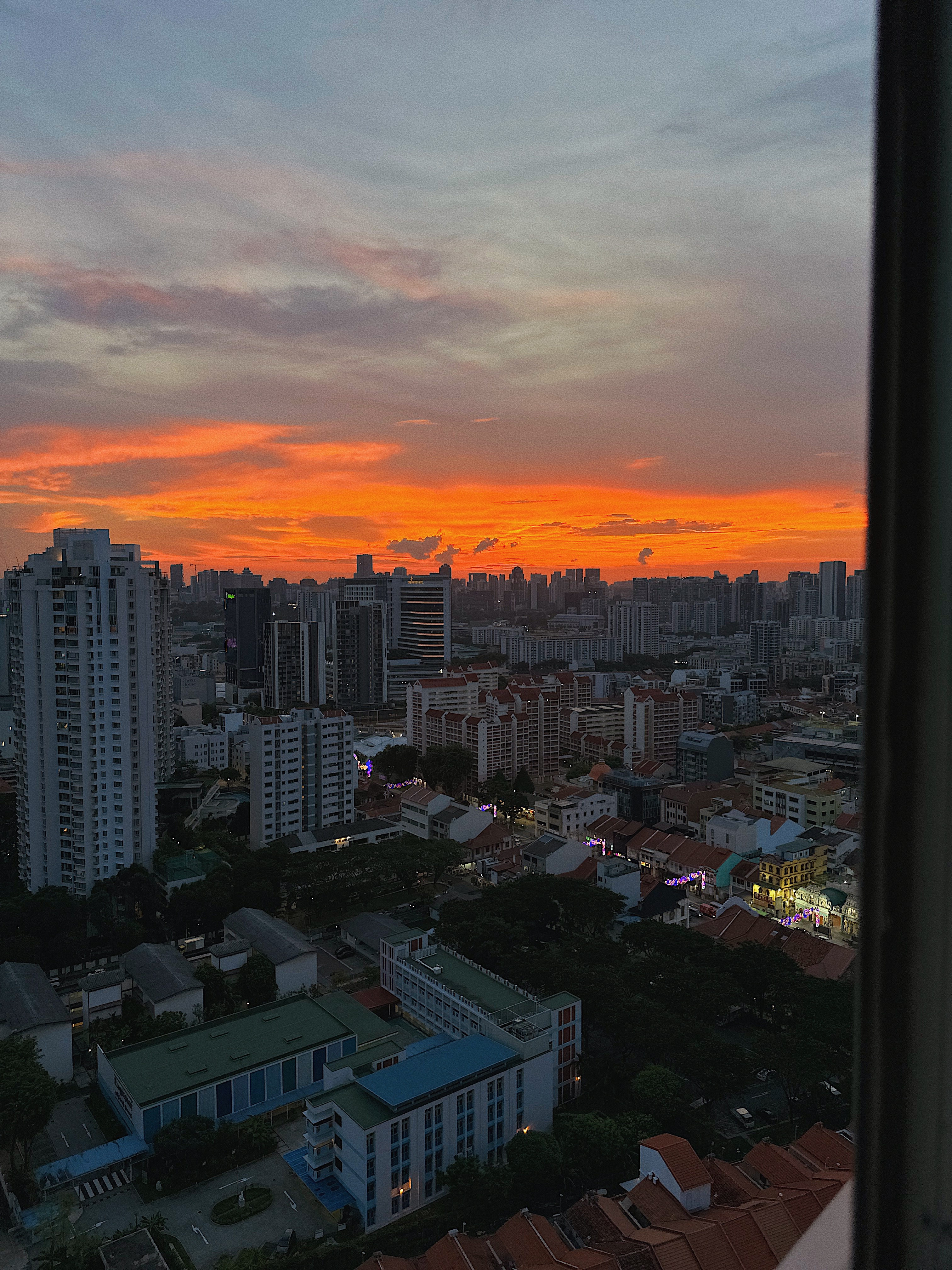 Love & Light: What Brings You Joy? - Sunset cityscape, vibrant sky, orange and pink hues, twilight ambiance, urban skyline