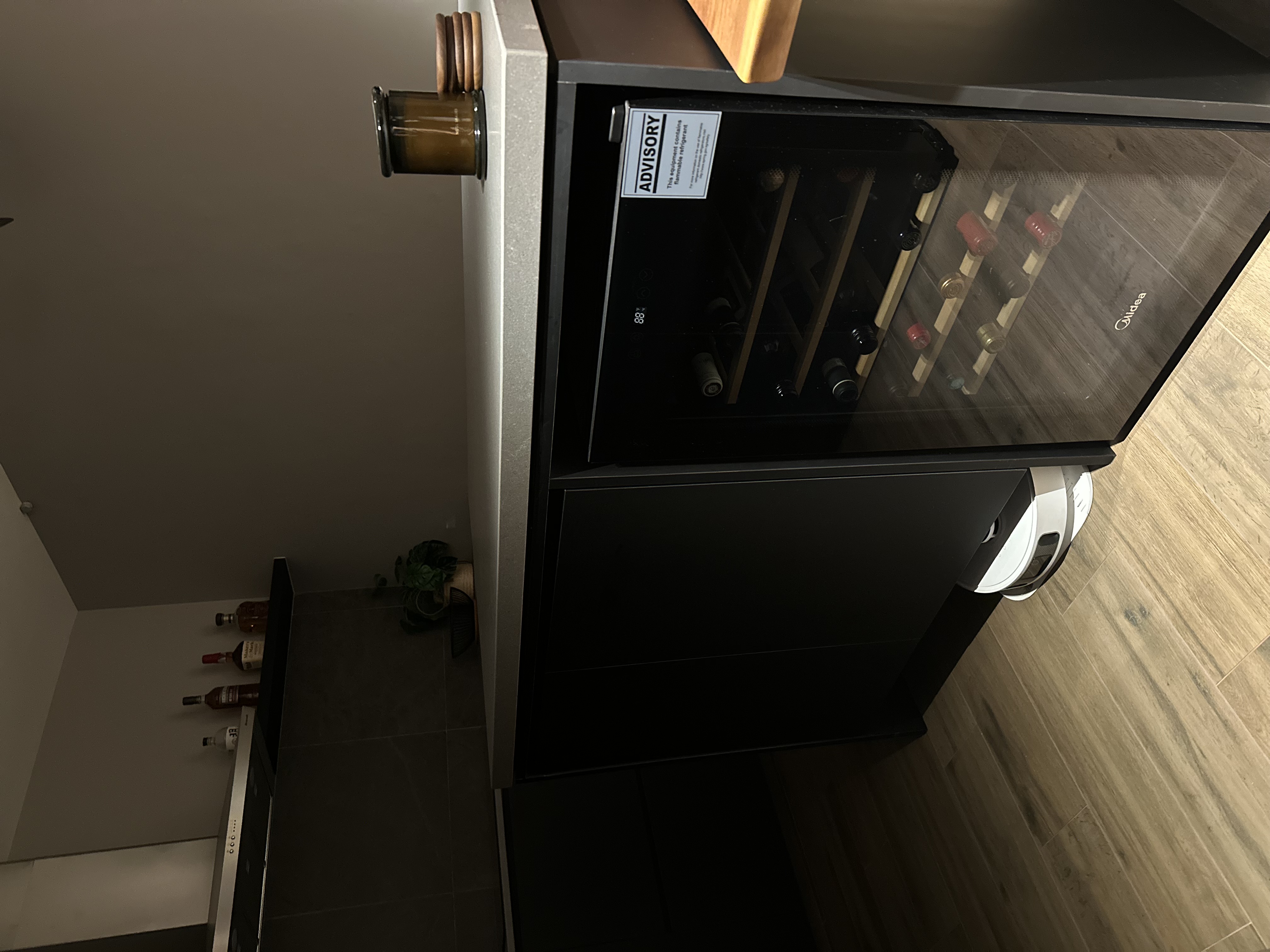 Where conversations, food, games and wine flow - Modern kitchen, wine rack, glass cabinet, dark wood flooring, minimalist